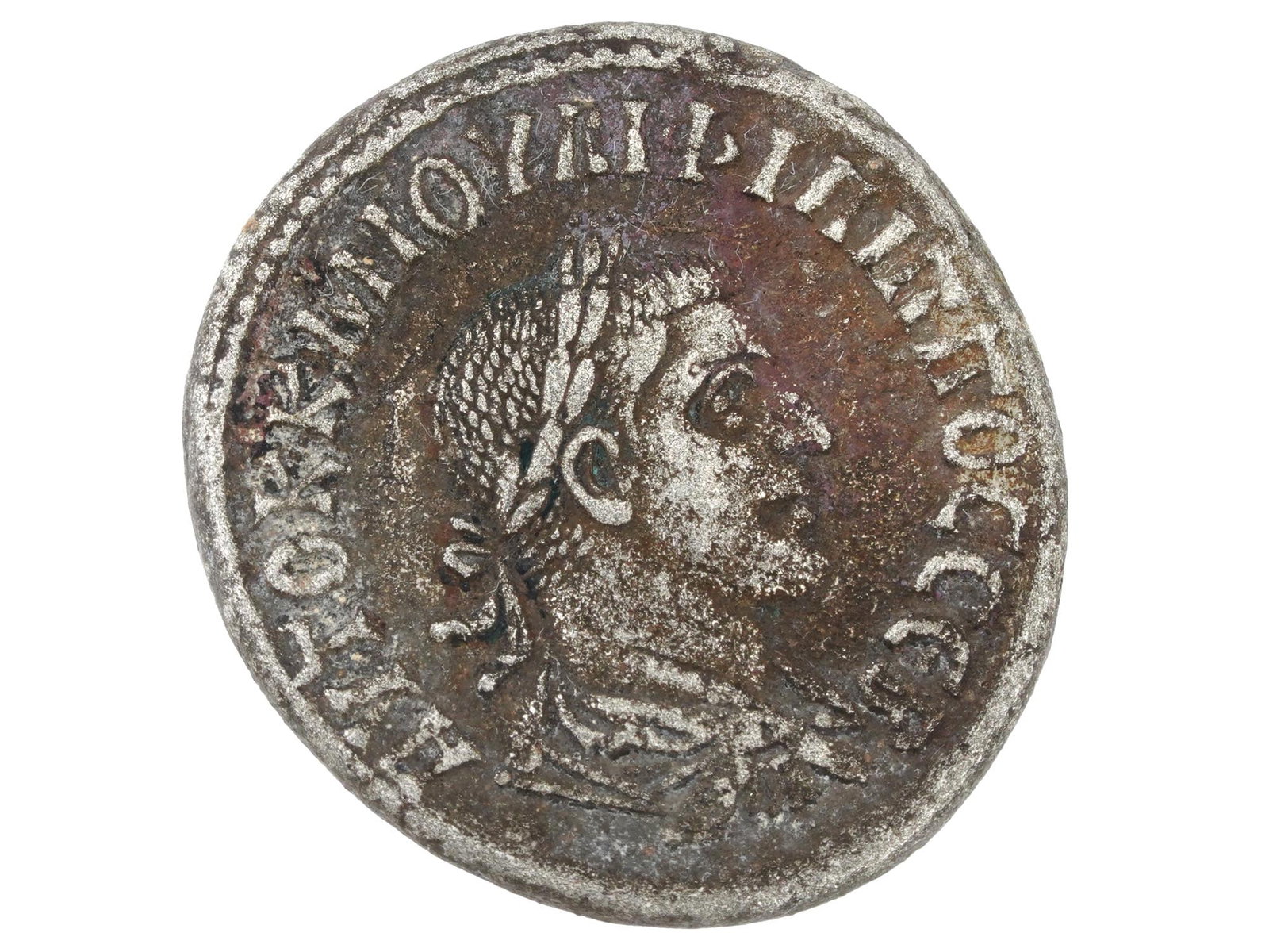 ANCIENT ROMAN EMPIRE TETRADRACHM SILVER COIN: An ancient silver tetradharm coin, Roman Empire, province of Syria, reign of Philip II, 247 to 249. On the obverse there is a draped bust of the emperor in a laurel wreath, turned to the right. On the