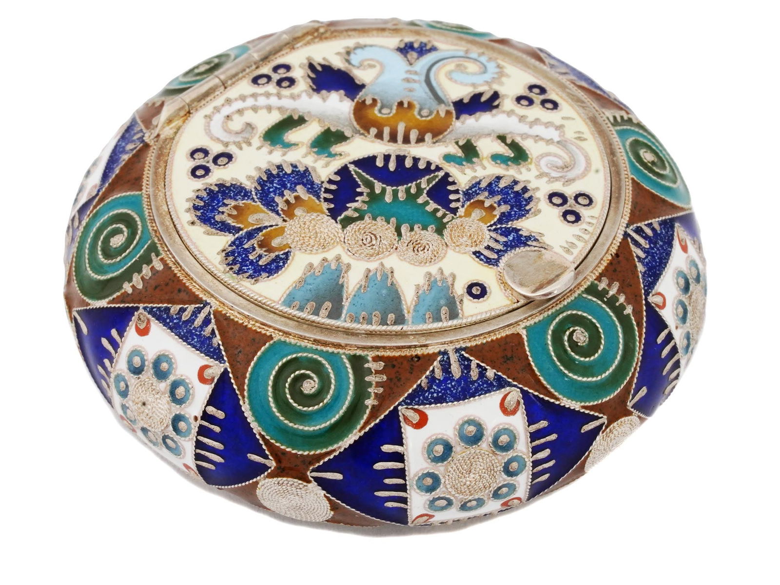 RUSSIAN SILVER CLOISONNE ENAMEL PILL BOX: A Russian round silver pill box with hinged lid. The exterior is decorated with polychrome cloisonne enamel in geometric ornaments. Hallmark of 88 silver standard and makers mark are on the bottom. To