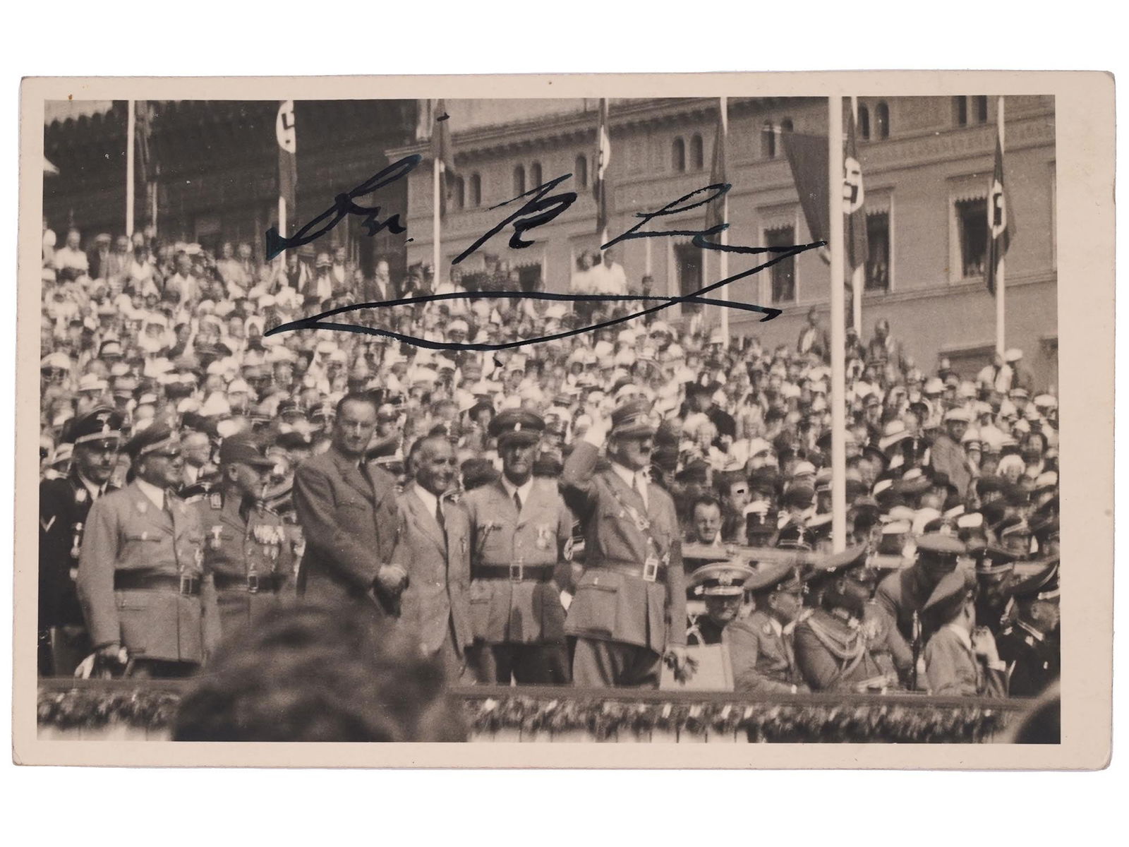 WWII ERA NAZI GERMAN ROBERT LEY AT TRIAL PHOTO SIGNED: A WWII era black and white printed photograph depicting a scene with Dr. Robert Ley at Herrenberg trial. Circa: 1938. Signed by Dr. Robert Ley, upper to the center. Inscribed in German and dated 1938,