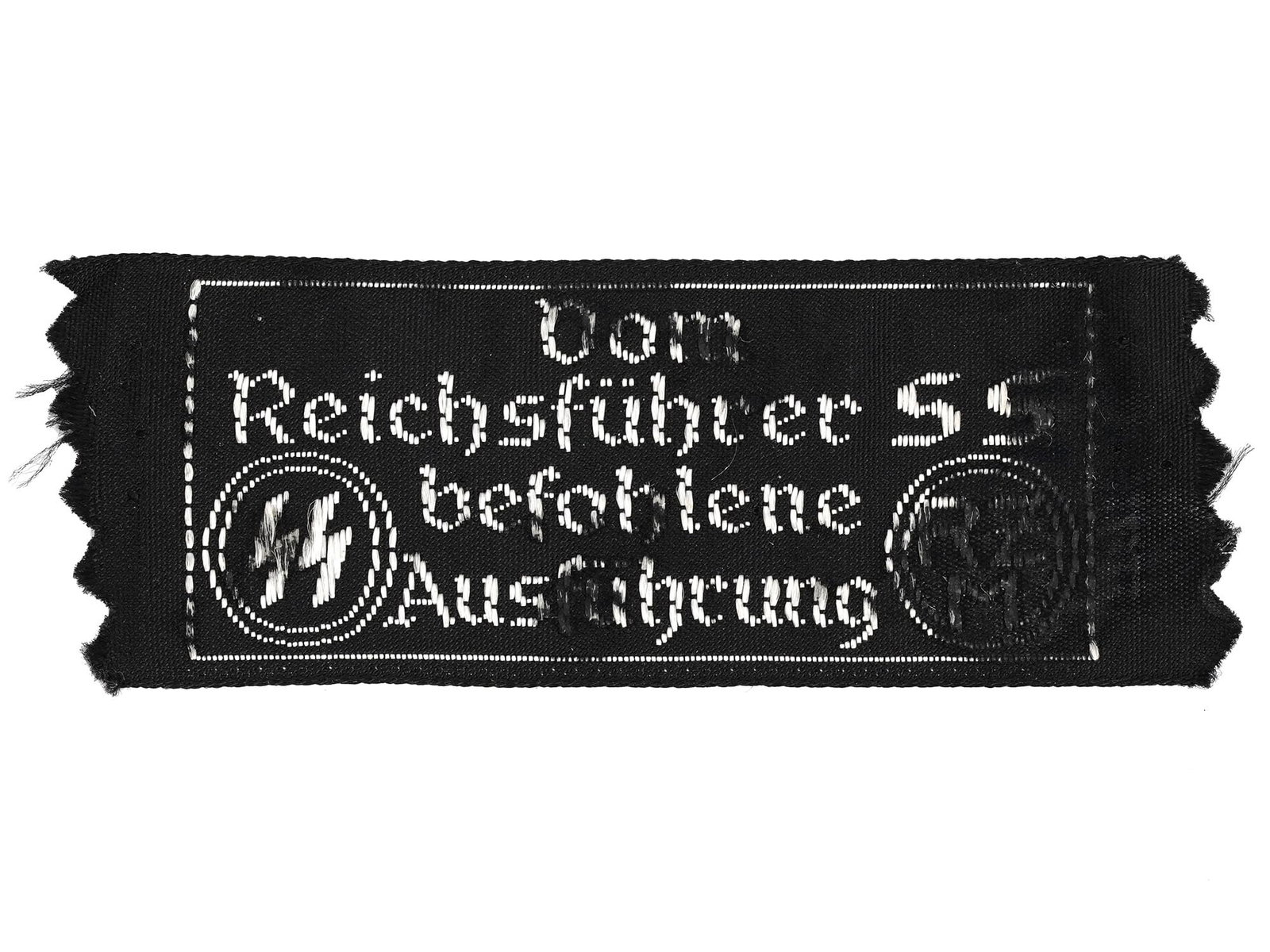 WWII MODEL NAZI GERMAN SS ?LOTHING TAG: A World War II model Nazi German military uniform tag. Black and white cotton piece, marked Vom Reichsfuhrer SS befohlene Ausfuhrung, SS, RZM. Second World War Historical Collectables And Memorabilia,