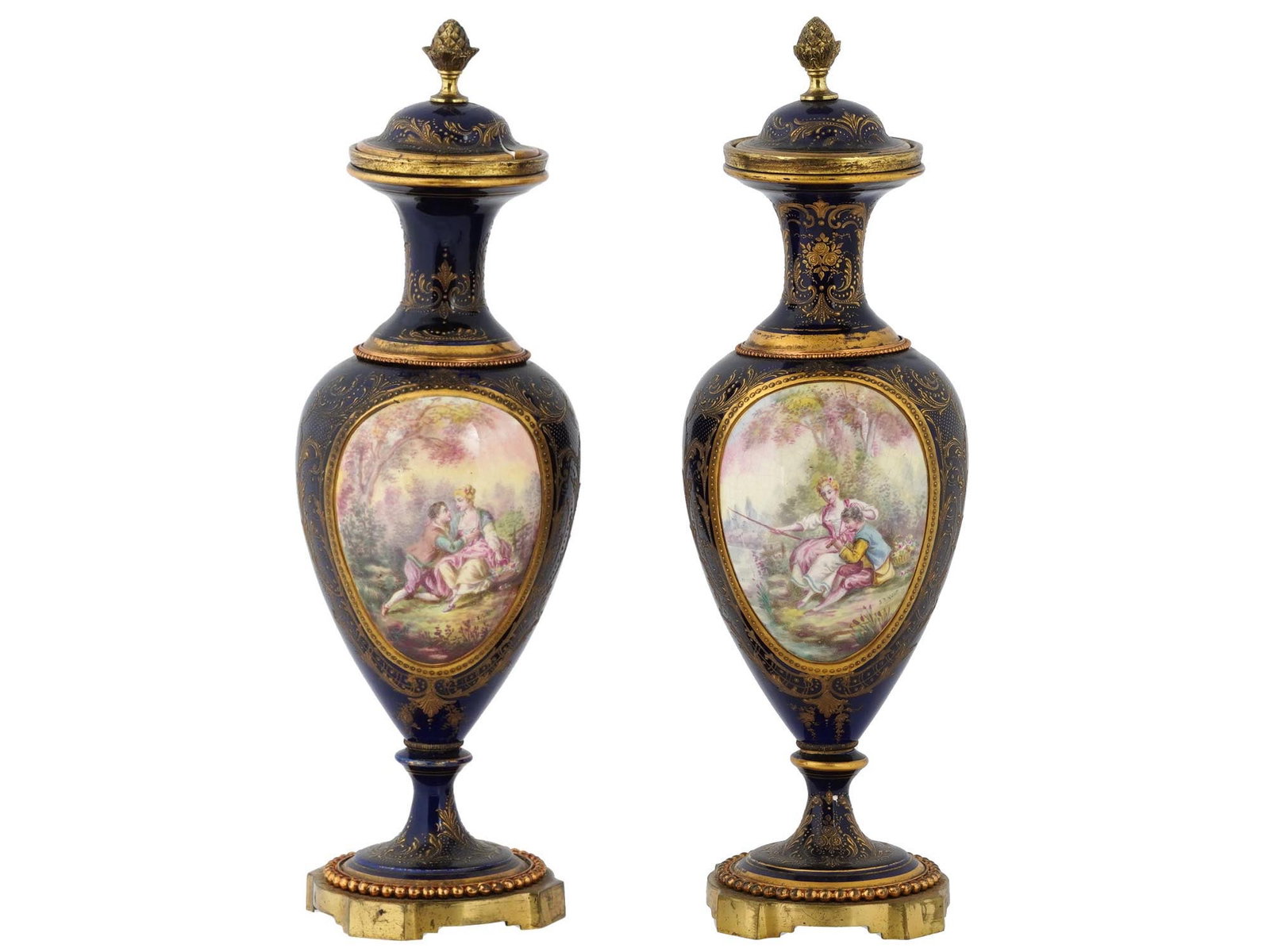 ANTIQUE FRENCH SEVRES PORCELAIN COVERED VASES: A pair of antique French Sevres covered vases, each crafted in porcelain and boasting a graceful baluster shape accented by gilt rims. Adorned with hand-painted gallant scenes delicately nestled withi