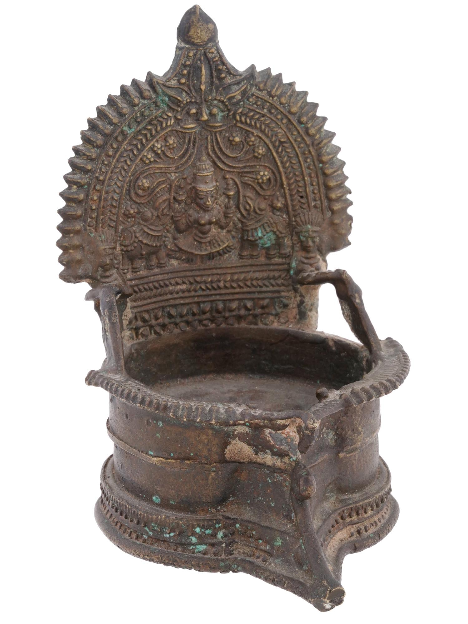 ANTIQUE ORIENTAL BRASS HERITAGE LAXMI OIL LAMP: An antique brass handmade Heritage Laxmi oil lamp. Features a meticulously carved depiction of the goddess Laxmi, the embodiment of wealth, prosperity, and light. Flanked on either side by majestic ju
