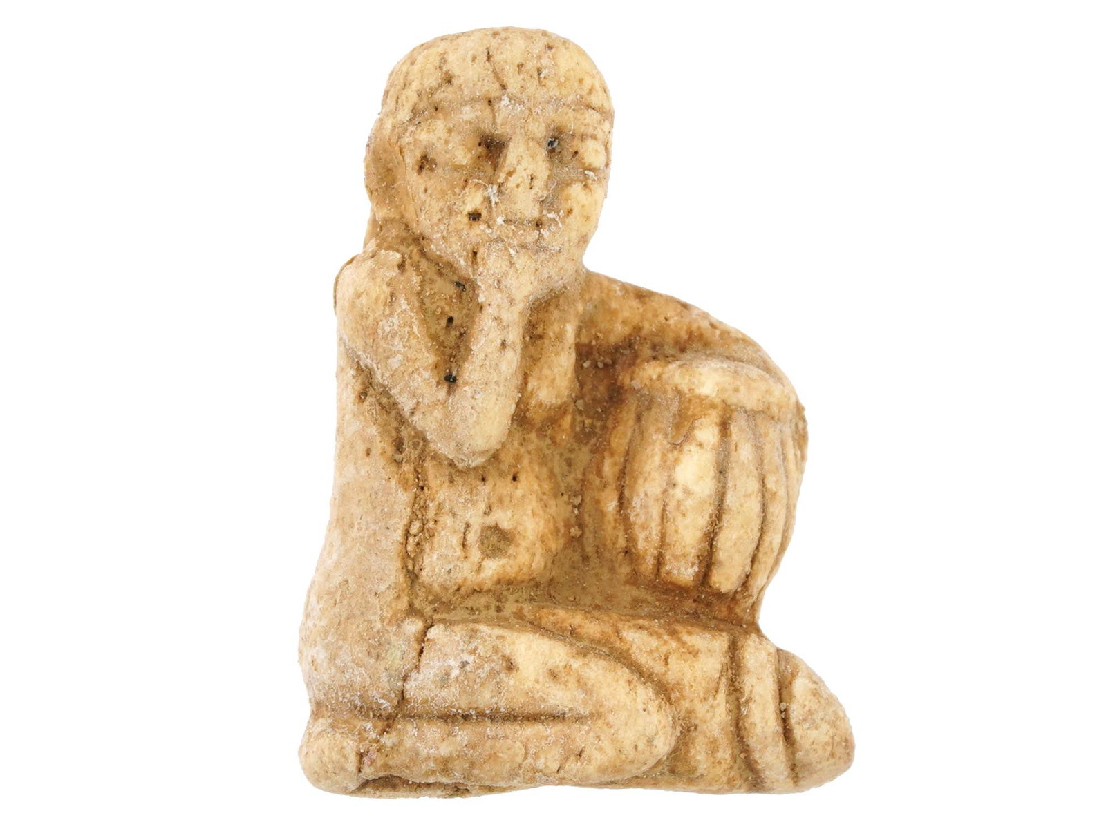 EGYPTIAN HAND CARVED NATURAL MATERIAL EROTIC PENDANT: A Egyptian hand carved from natural material figural pendant made in the ancient manner. The pendant represents a female erotic figure, carved with detailed patterns. An opening for wearing on the bac