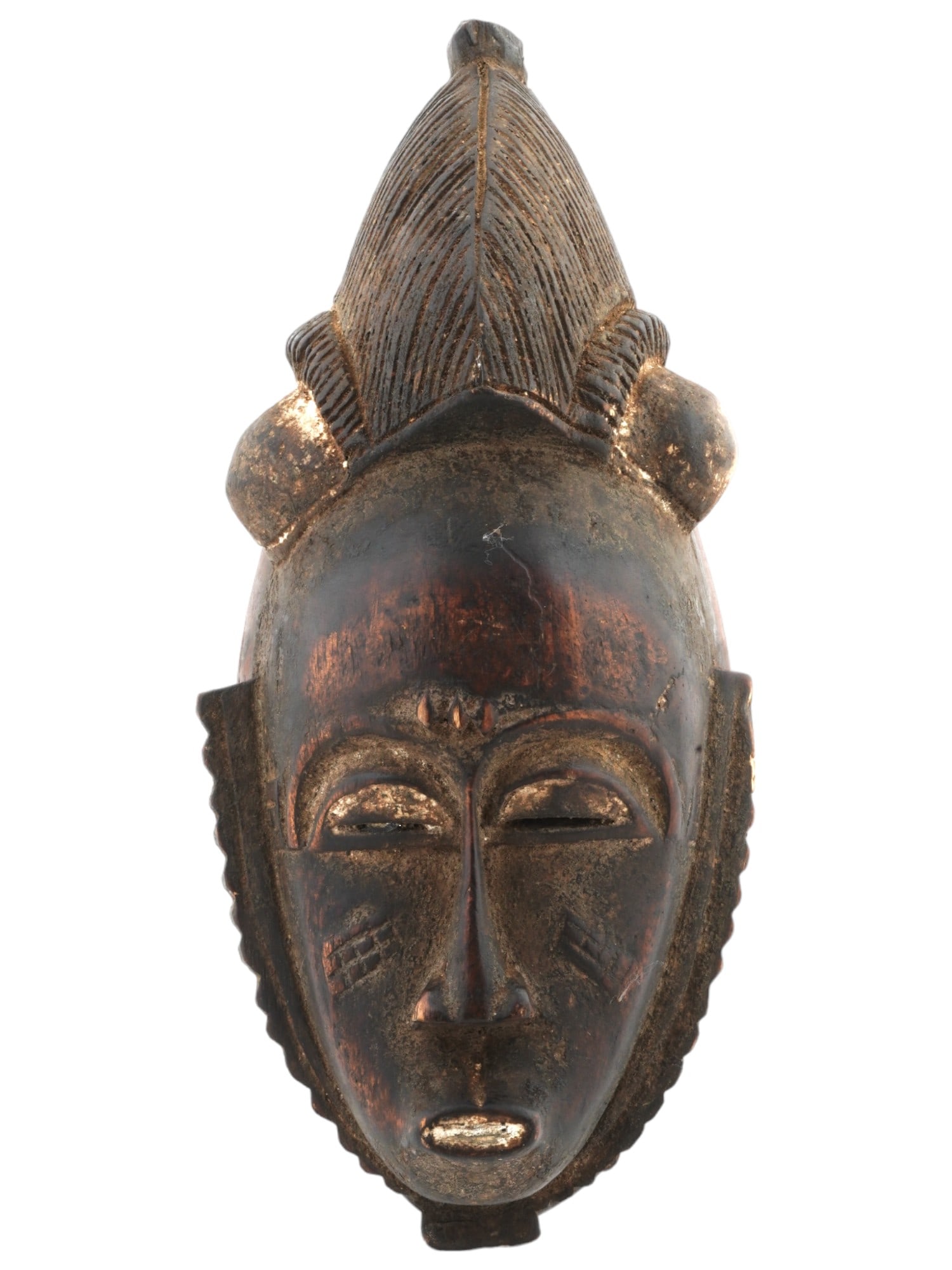 ANTIQUE AFRICAN BAULE TUNTUM HAND CARVED WOOD MASK: An antique Central African Baule Tuntum hand craved mask. The mask is modeled with narrow eyes, a small mouth, a wide collar that completely covers the neck, and a high headdress. Tuntum in the Akan l