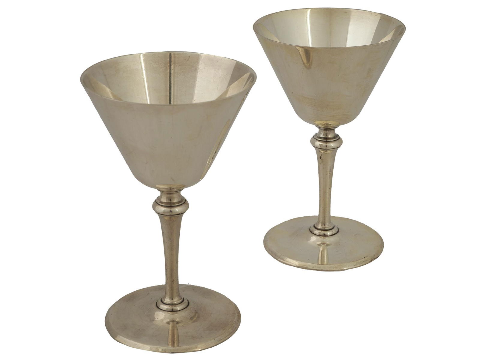 PAIR OF VINTAGE TIFFANY STERLING SILVER WINE GOBLETS: Pair of vintage Tiffany and Co. sterling silver wine goblets. Each goblet features a gracefully flared bowl and a slender, stylish stem, culminating in a stable base. Hallmark on the bottom: Tiffany a