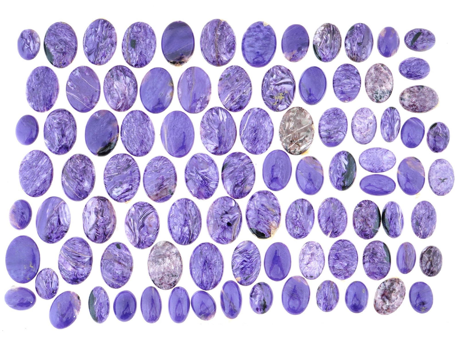 LARGE COLLECTION OF CARVED OVAL CHAROITE STONES (1 of 3)