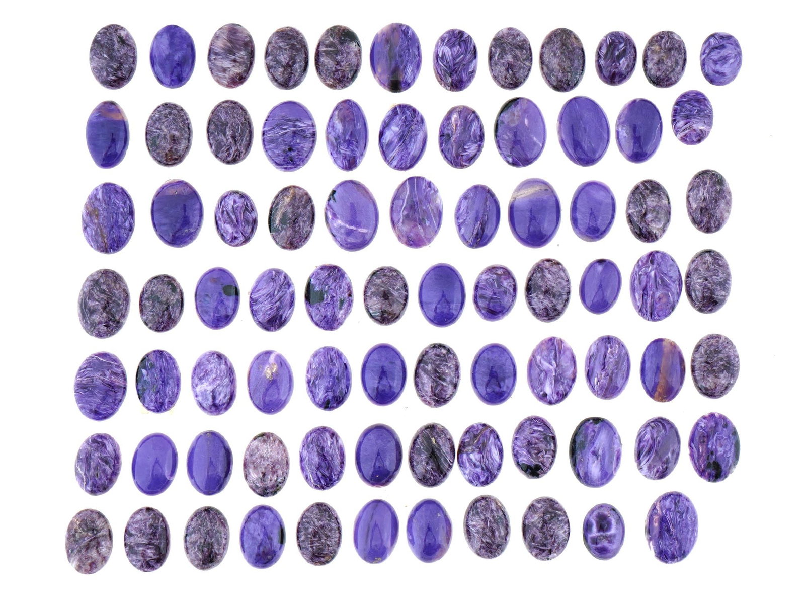 LARGE COLLECTION OF CARVED OVAL CHAROITE STONES: A large collection of charoite stones. A total of 80 pieces of miniature size. Oval cabochon shape, polished surface. Can be used for jewelry creation. Total Weight: 150 grams. Charoite is a rare mine