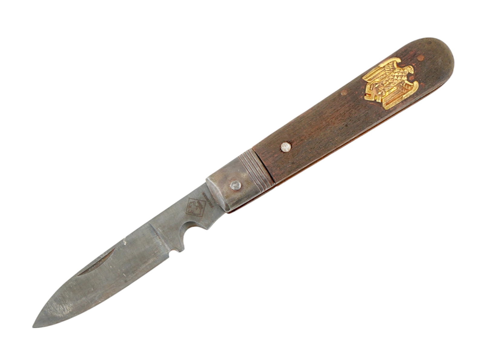 GERMAN WWII TYPE ARMY POCKET KNIFE BY PUMA SOLINGEN: A WWII type Nazi German Army stainless steel pocket knife with a wooden handle. The handle is decorated with an overlay representing a Nazi eagle clutching a swastika. Marked, Puma Solingen, RZM, M7 2