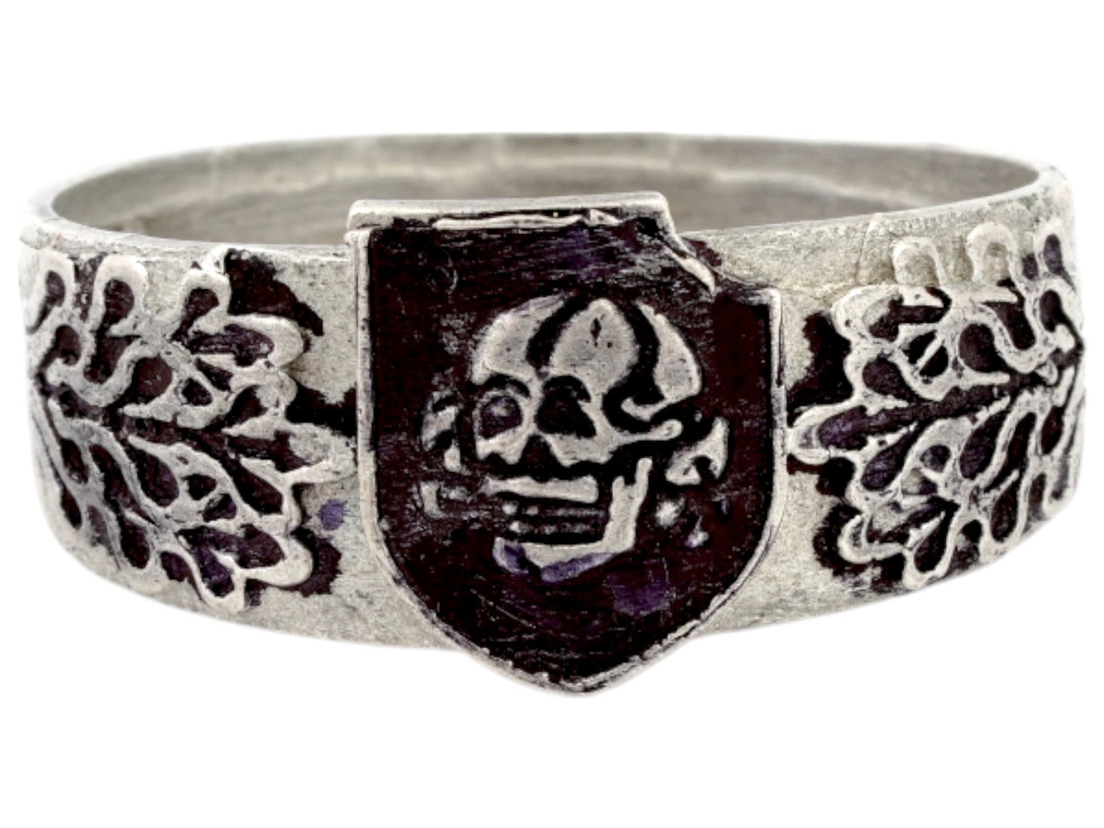 GERMAN WWII TYPE WAFFEN SS DIVISION TOTENKOPF SILVER RING: A WWII Nazi German Third Reich type Waffen SS Division Totenkopf Silver signet ring. The exterior of the ring is engraved with a Totenkopf skull insignia on a shield in the center, and oak leaves on t