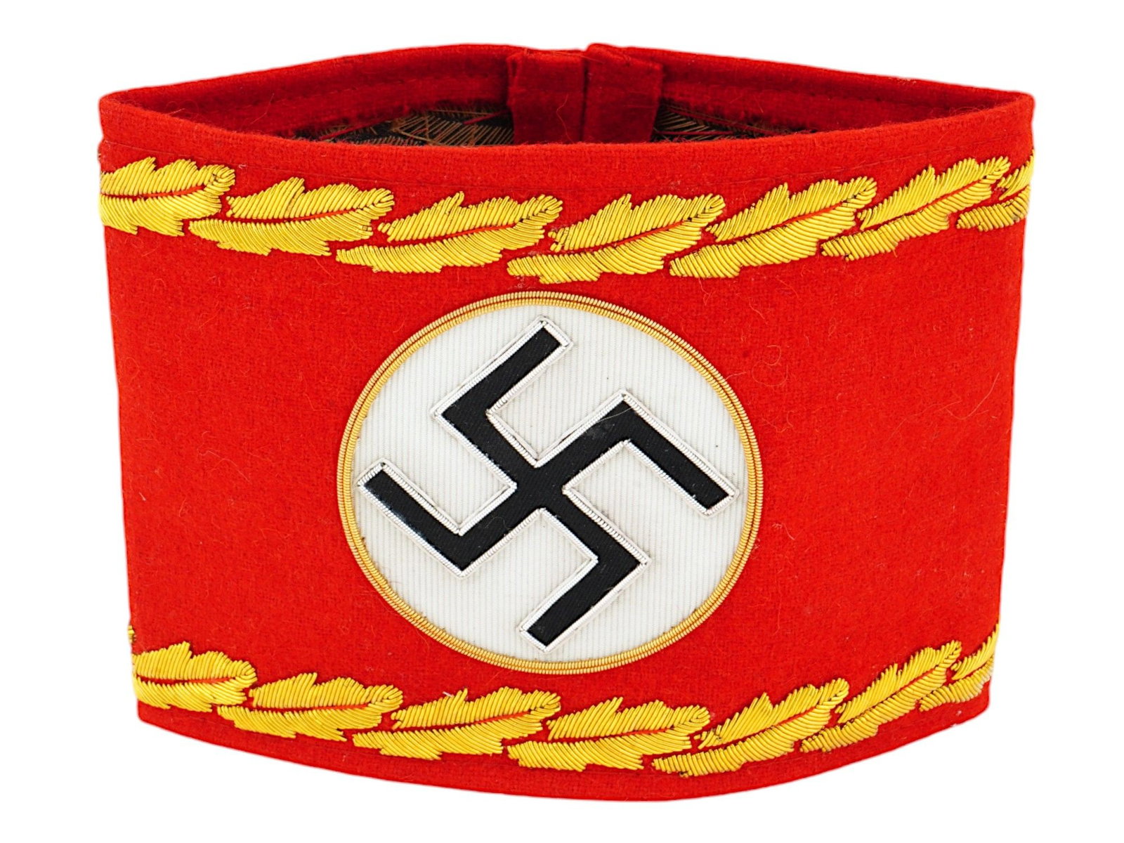 GERMAN WWII TYPE NSDAP REICHSLEITER ARMBAND: A WWII type Nazi German Third Reich era NSDAP Reichsleiter National Level armband. Made of red felt with golden thread embroidery, features a Swastika emblem and an oak leaves pattern. Second World Wa