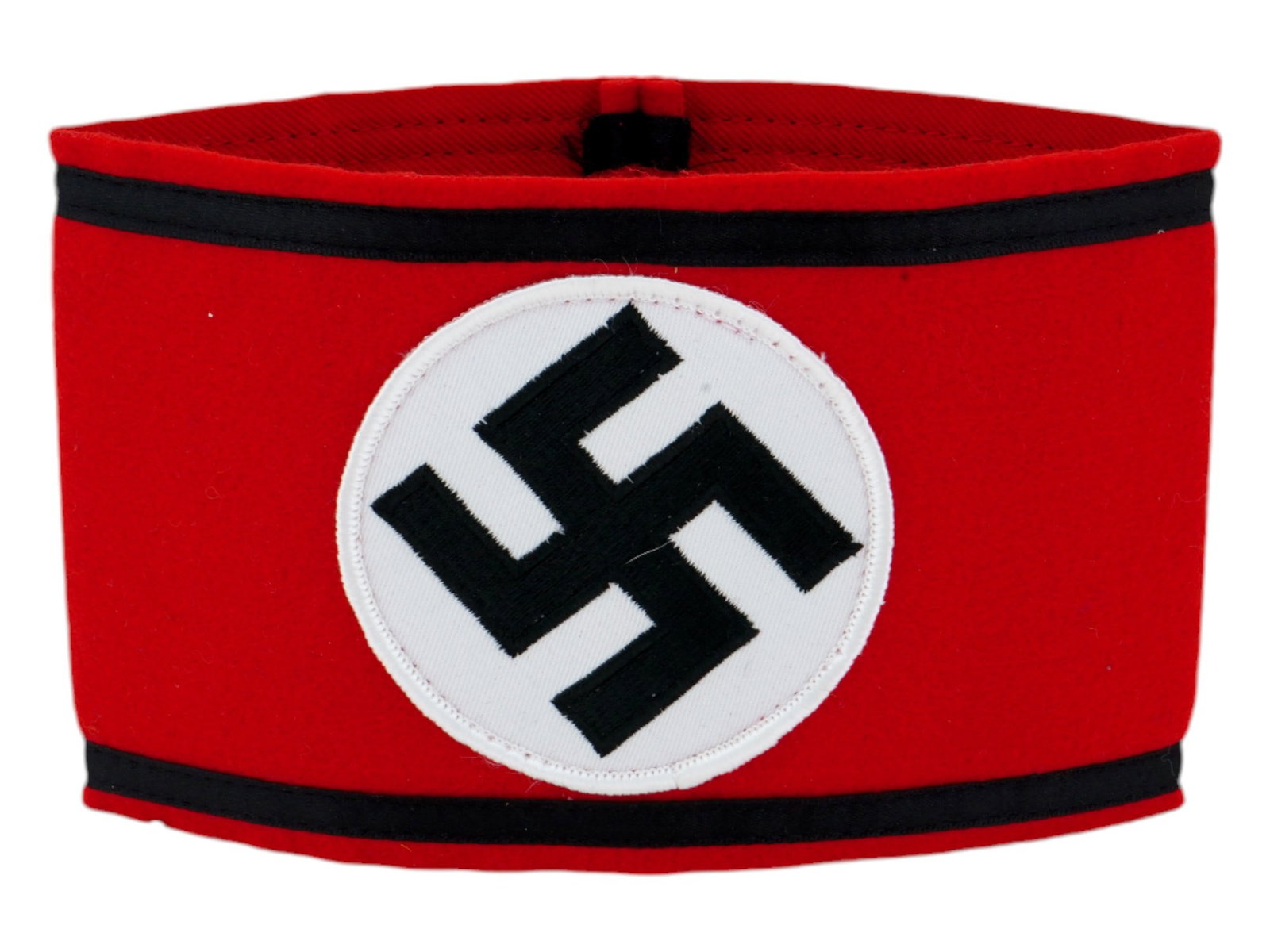 GERMAN WWII TYPE THIRD REICH TYPE SS ARMBAND: A WWII type Nazi German Third Reich SS armband featuring a red cotton based field with a central, circular field with a canted, ribbed, black rayon tape swastika to the front center. The top and botto