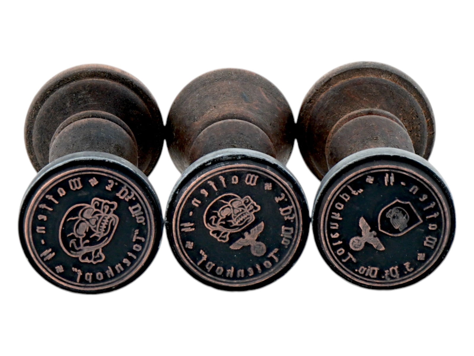 GROUP OF THREE GERMAN WWII TYPE WAFFEN SS HAND STAMPS: A lot of three World War II type Nazi German wooden ink seals or hand stamps of Waffen SS Division Totenkopf featuring a Totenkopf skull with bones swastika insignia, and a Nazi eagle clutching a swas