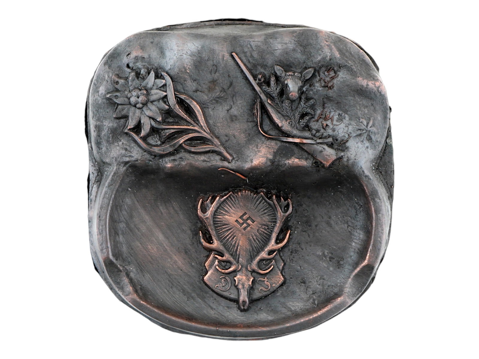 GERMAN WWII THIRD REICH PERIOD HUNTING SOCIETY ASHTRAY: A WWII type Nazi German Third Reich Hunting Society guest house ashtray. The ashtray features relief images of an Edelweiss flower, a deer with a gun, and a head of a deer with a swastika insignia. Fe