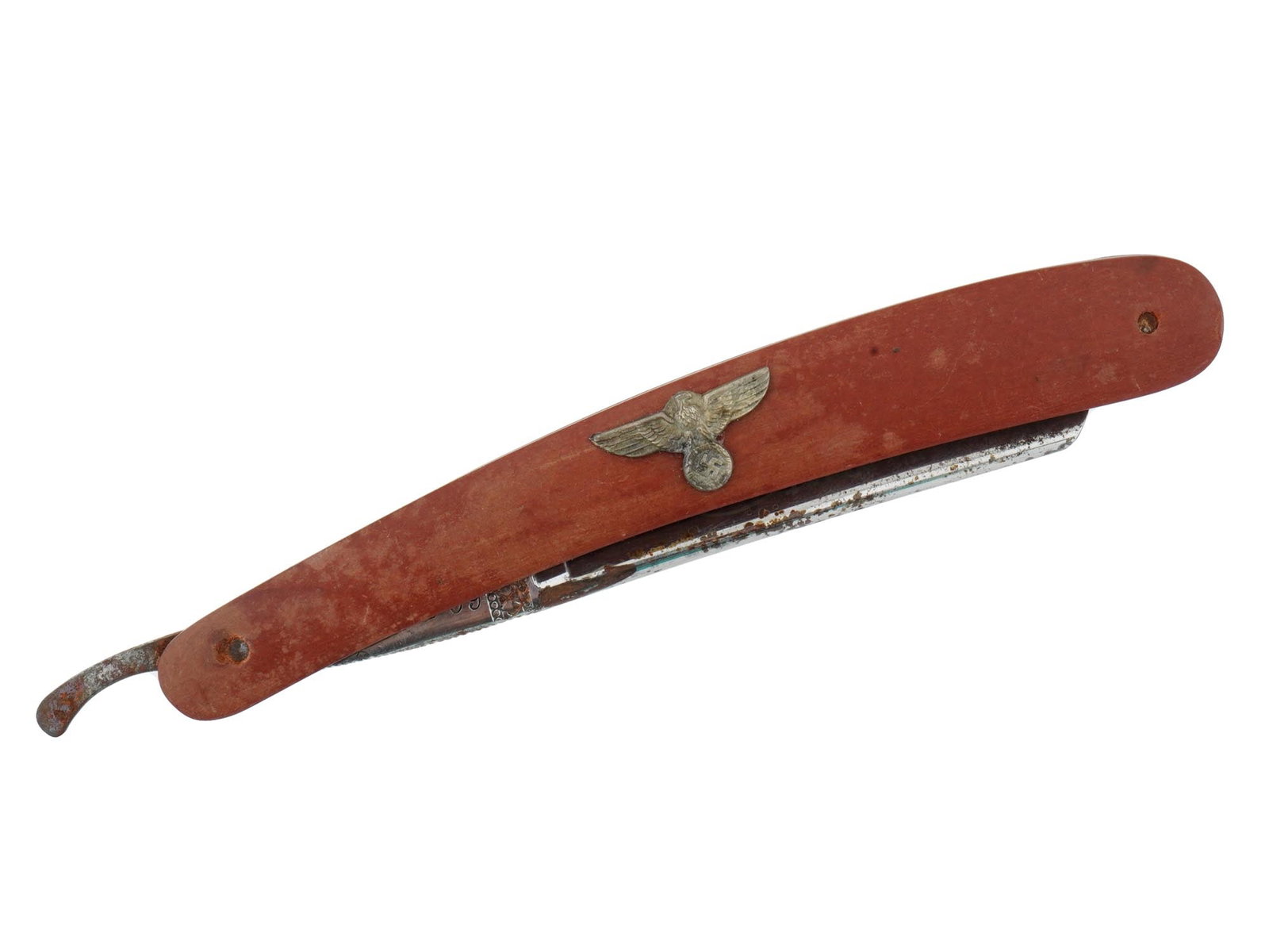 GERMAN WWII TYPE NSDAP OFFICIALS STRAIGHT SHAVING RAZOR: A WWII type Nazi German Third Reich NSDAP straight shaving razor. The handle is adorned with a Synthetic base, adorned with an overlay depicting the Nazi eagle with swastika insignia in its claws, to 