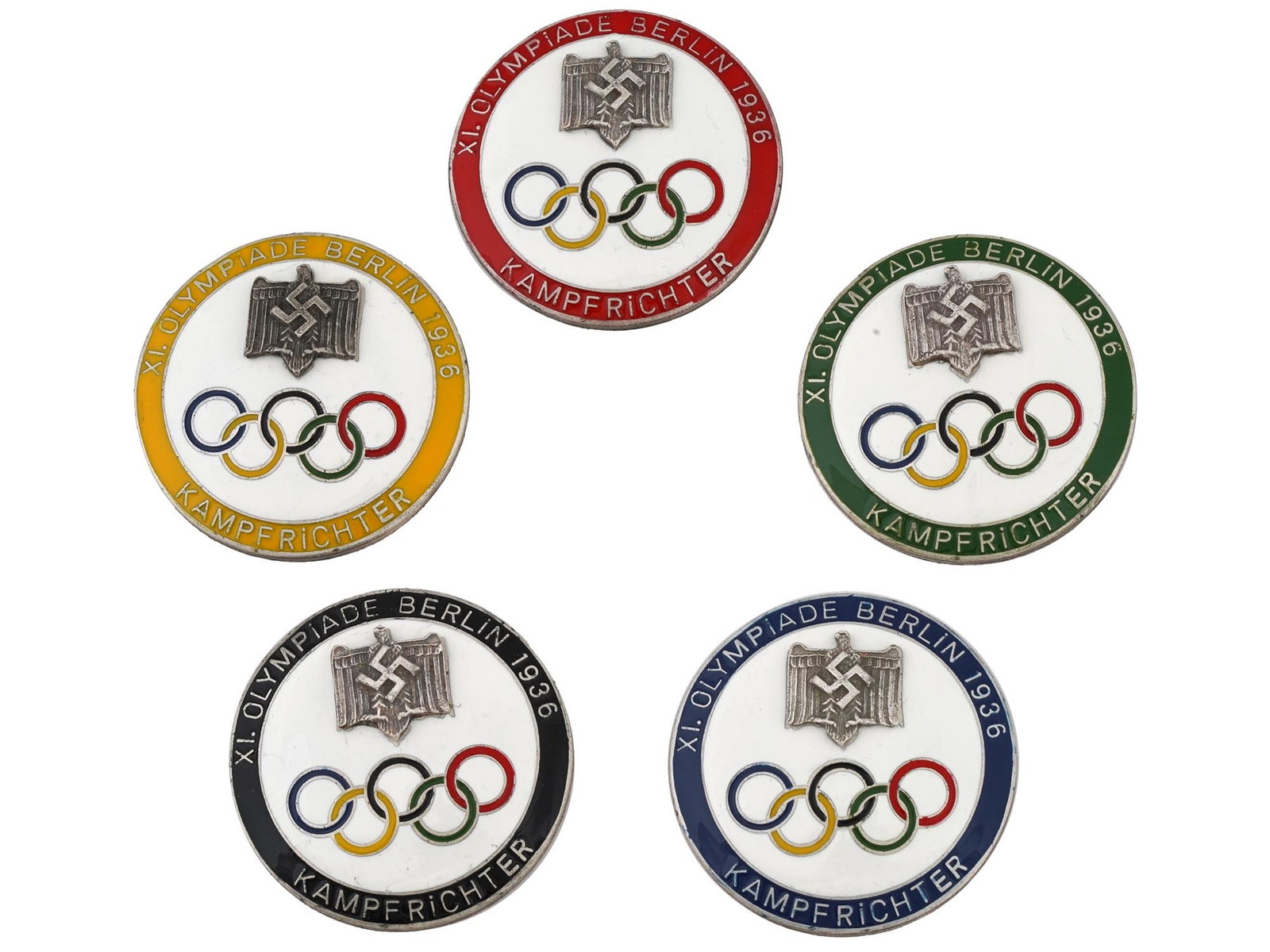 GERMAN PRE WWII TYPE OLYMPICS REFEREE ENAMEL PIN BADGES: A group of five German pre WWII type 1936 Berlin Olympics referee multicolored enamel pin badges, each featuring a Nazi eagle with a swastika above the Olympic rings. Marked on the back side. Pre WWII