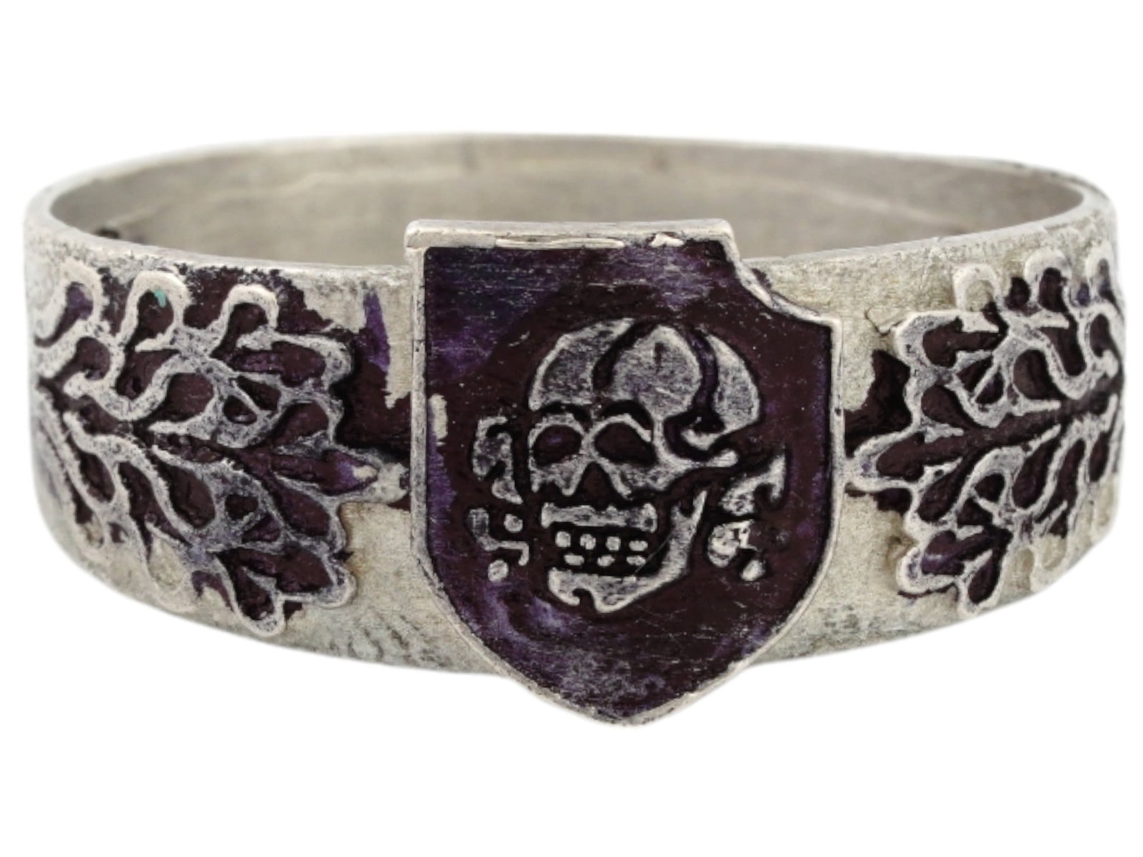 GERMAN WWII TYPE WAFFEN SS DIVISION TOTENKOPF SILVER RING: A WWII Nazi German Third Reich type Waffen SS Division Totenkopf Silver signet ring. The exterior of the ring is engraved with a Totenkopf skull insignia on a shield in the center, and oak leaves on t