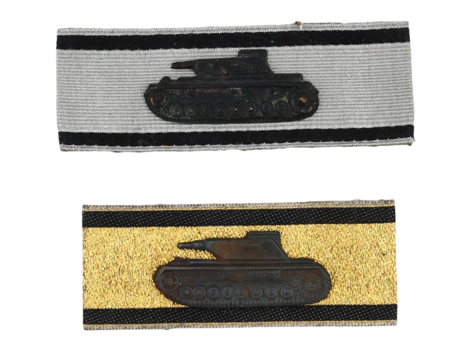 2 WWII TYPE NAZI GERMAN TANK DESTRUCTION AWARDS: A set of 2 German WWII type tank destruction awards: in silver and in gold, with an attached Panzer IV tank overlay. The badge was pinned to the sleeve, and then was sewn on. Second World War Nazi Ger