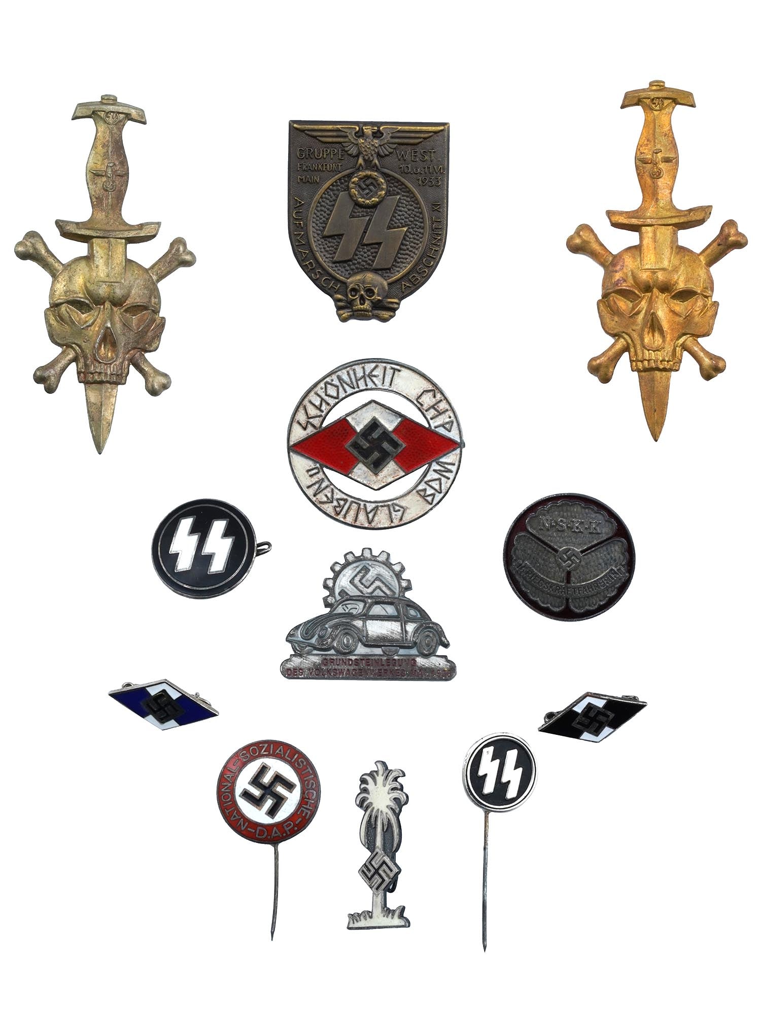 GROUP OF 11 GERMAN WWII TYPE BADGES AND PINS: A Group of 11 German WWII type badges and pins. The lot includes two Wehrmacht Assault Badges, an SS Group West Frankfurt Rally enamel badge with a skull, the Hitler Youth Third Reich B.D.M League of 