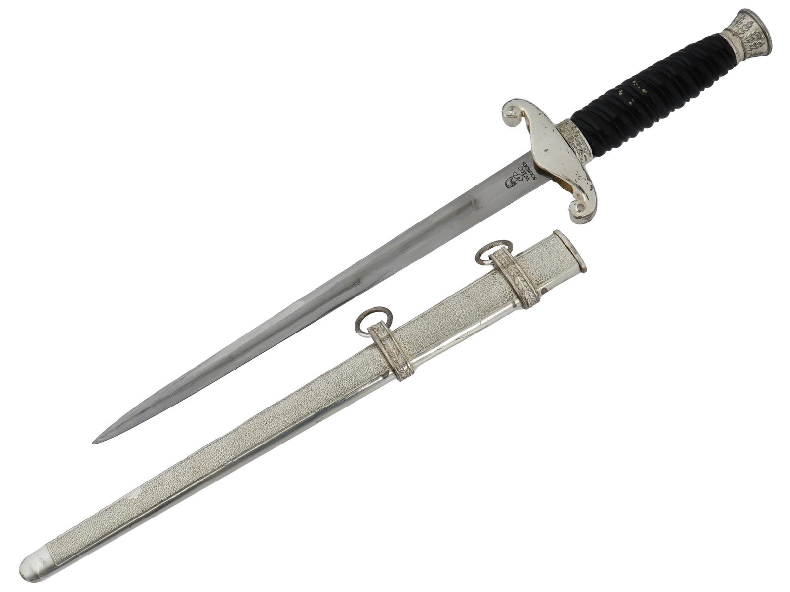 GERMAN WWII MODEL LAND CUSTOMS DAGGER BY WKC SOLINGEN: A WWII model Nazi German land customs official dagger. Marked on the ricasso WKS SOLINGEN along with a knights helmet emblem. The cross guard is decorated with an image of an eagle clutching a swastik