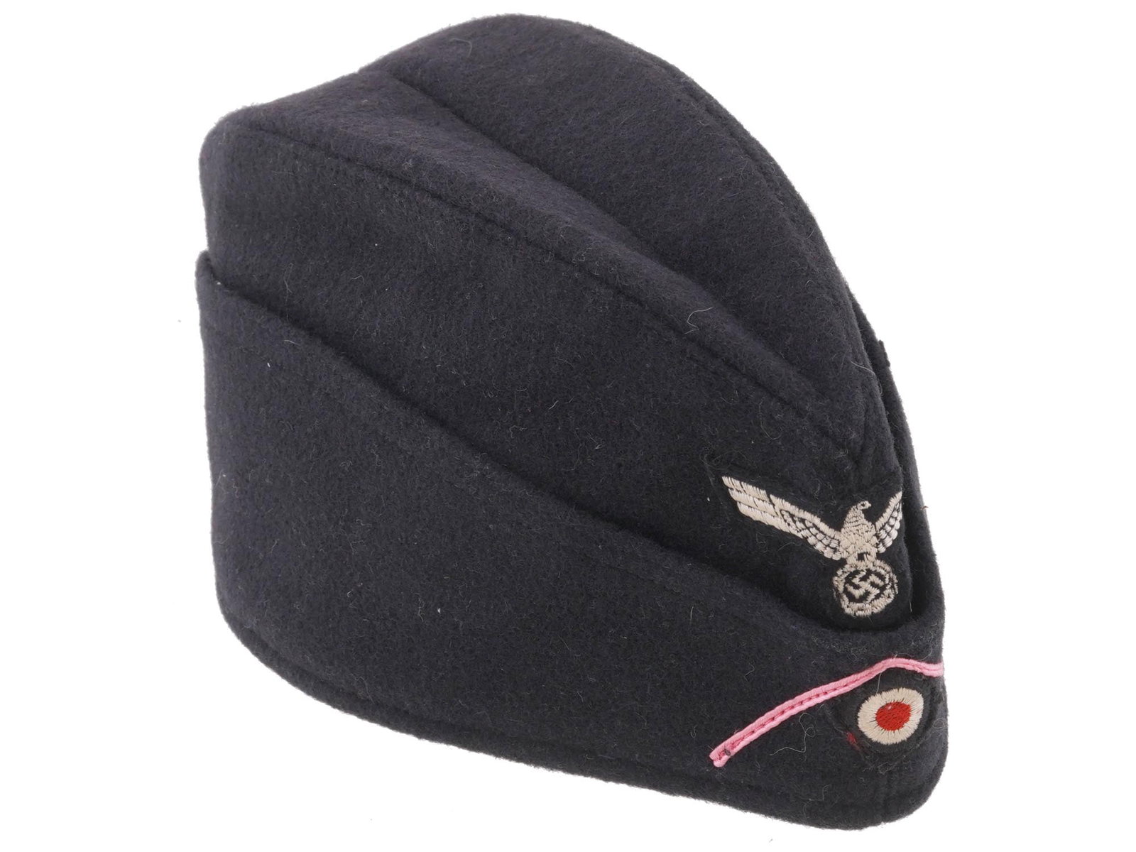 WWII TYPE NAZI GERMAN ARMY PANZER M34 OVERSEAS CAP: A WWII type Nazi German Army Panzer EM NCOs M34 overseas cap. Constructed of a black blue wool exterior, with a cotton lining. An original BeVo-woven Panzer cap-eagle is neatly machine-sewn on front o