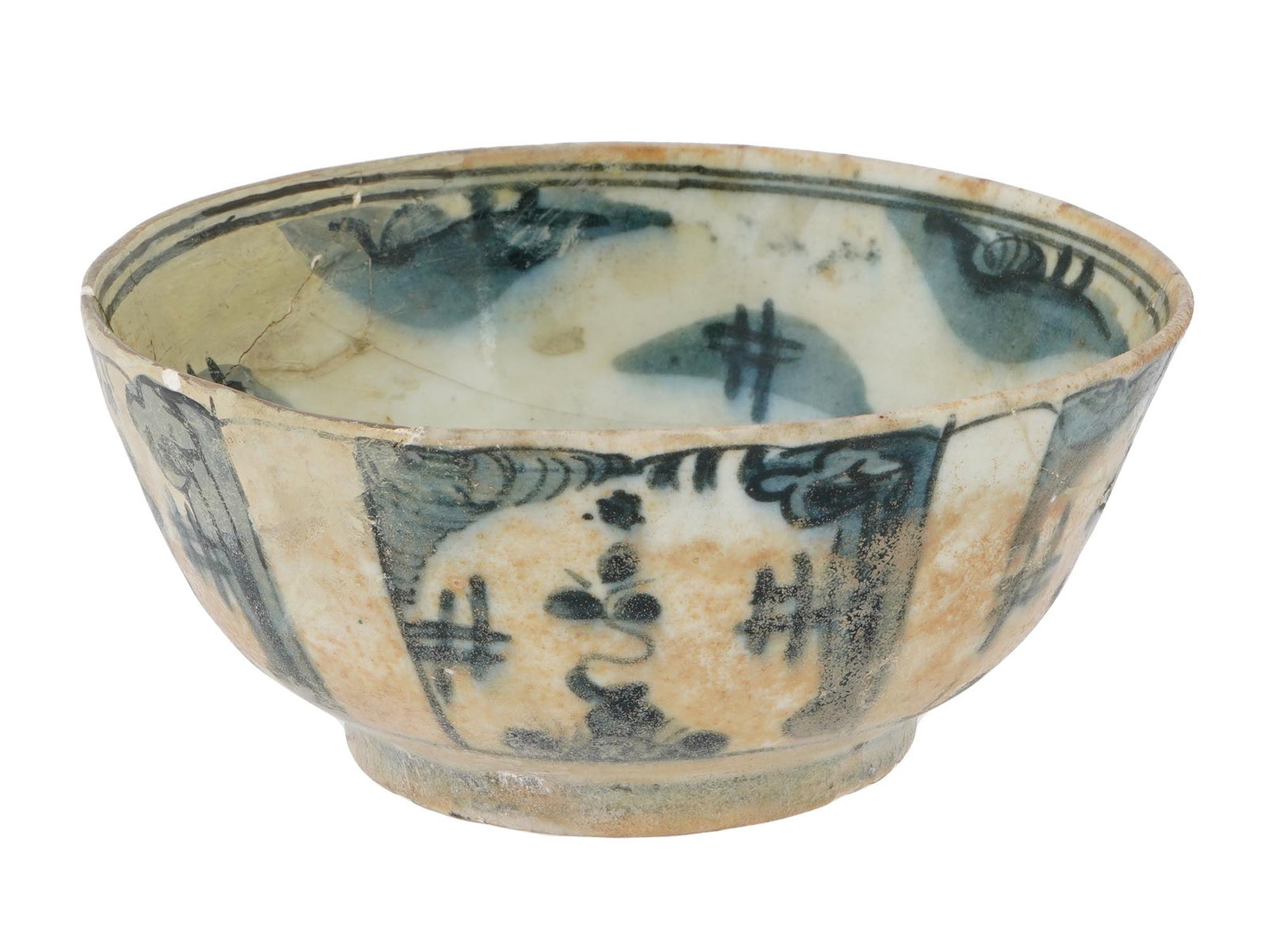 ANTIQUE CHINESE MING DYNASTY SWATOW POTTERY BOWL: An antique Chinese, Ming Dynasty, Swatow pottery bowl. The exterior of the bowl is adorned with hand enameled cobalt blue scrolling floral and foliage motifs, raised on a low pedestal. The interior is