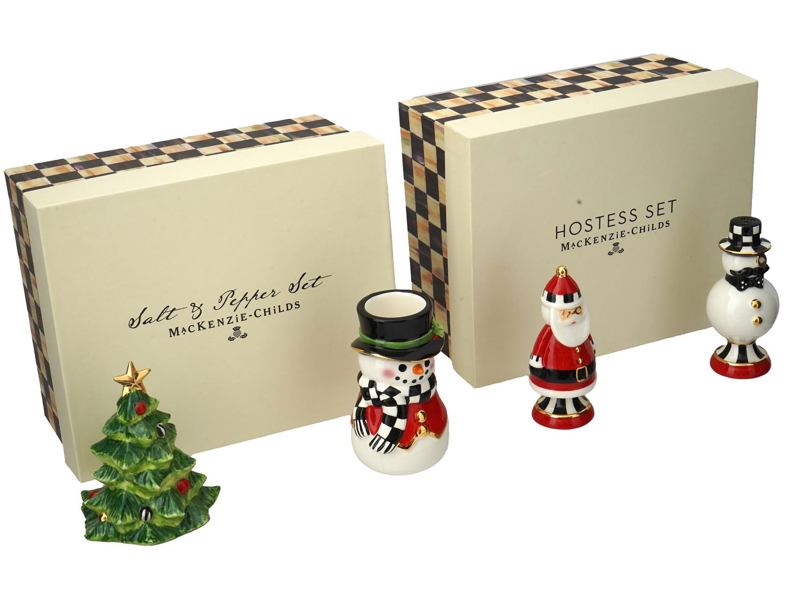 MACKENZIE-CHILDS PORCELAIN CHRISTMAS SETS IOB: A pair of vintage Christmas-themed porcelain tableware sets by MacKenzie-Childs. First. Checkmate Duo salt and pepper shakers set, Santa Claus and Snowman. Second. Hostess set, Christmas tree and Snow