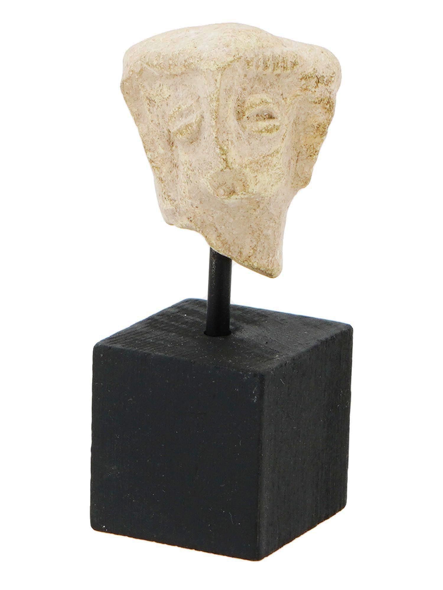 ANCIENT HITTITE TERRACOTTA HEAD SCULPTURE CA 1600 BC: An ancient Hittite terracotta head sculpture. Circa 1600 to 1200 BC. The sculpture is a stylised terracotta head, possibly of a local deity, with large facial features and a depression on top of the h