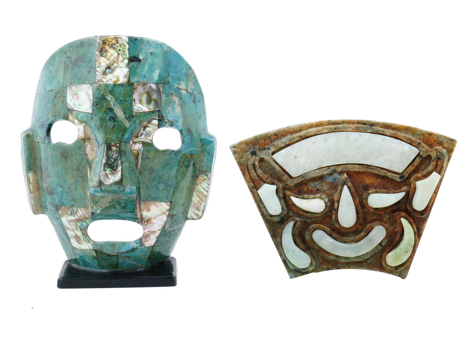 VINTAGE MEXICAN CARVED STONE AND MOTHER OF PEARL MASKS: A lot of 2 vintage Mexican carved stone masks. The first mask is made in a mosaic design with mother of pearl inserts, with holes for the eyes and mouth. It is mounted on a stand. The second flat mask