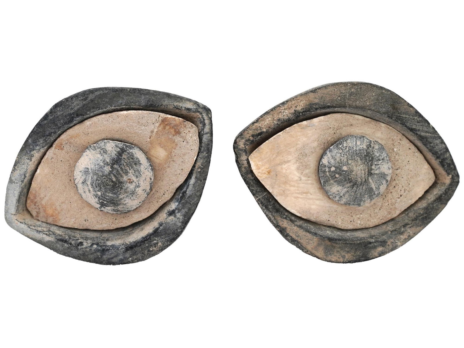 PAIR OF ANCIENT CARVED STEATITE EYES OF SEPARATE PARTS: A pair of ancient carved steatite eyes, dating back to 2000 BC. Each eye consists of three separate parts: the iris, sclera, and eyelids, showcasing intricate craftsmanship and attention to detail. An