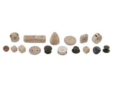GROUP OF ANCIENT BRONZE AND STONE GAMBLING PIECES