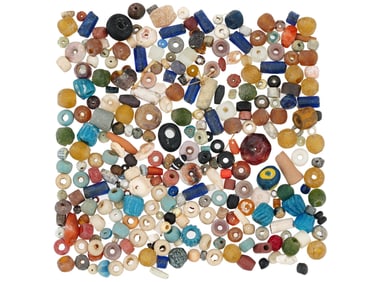 ANCIENT STONE AND GLASS BEADS OF VARIOUS DESIGNS