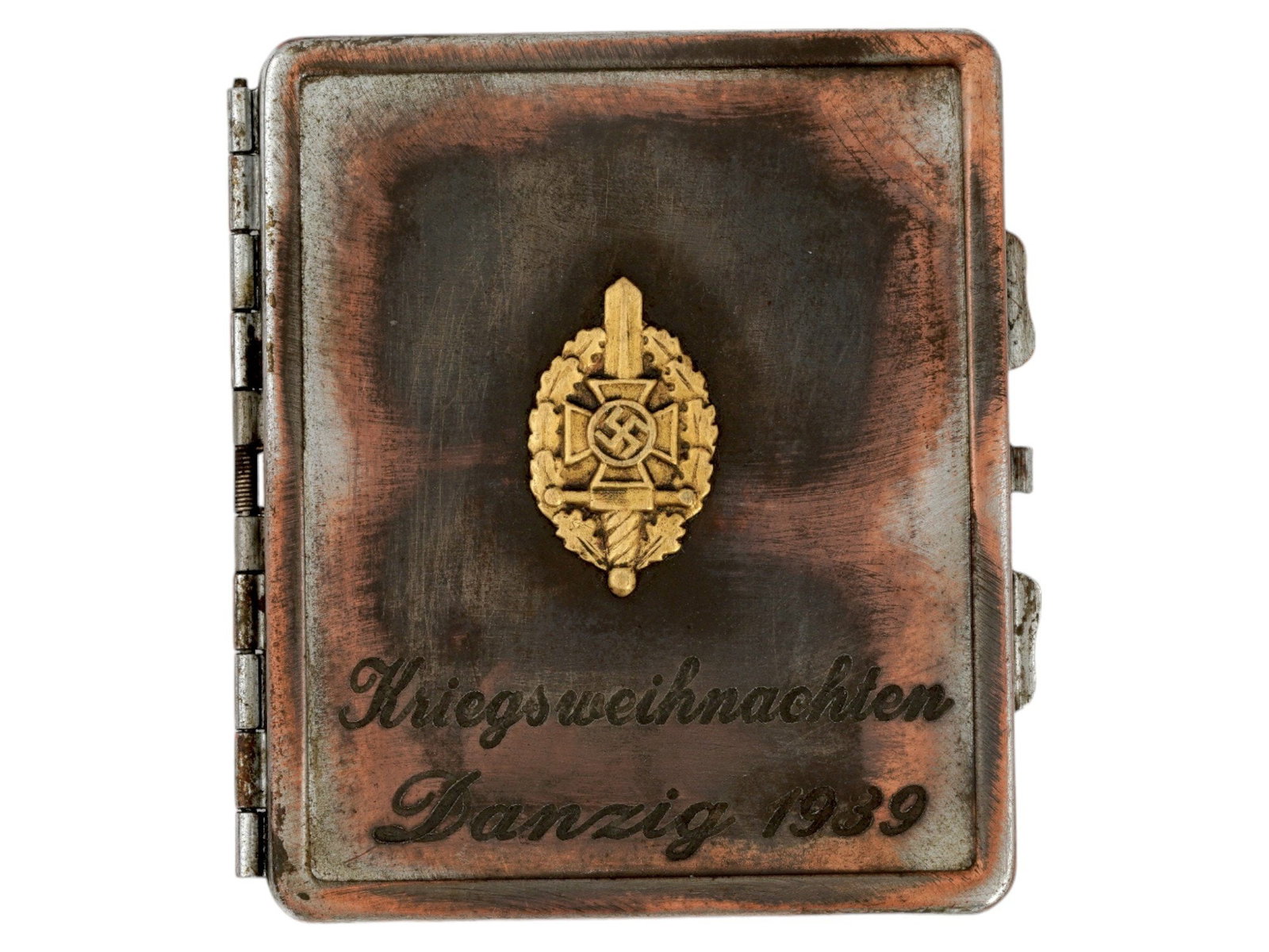 GERMAN WWII TYPE KREIGSMARINE CHRISTMAS CIGARETTE CASE: A WWII Nazi German Third Reich type Kriegsmarine Naval metal cigarette case. The case is adorned with a relief gold tone medallion representing a cross with a weapon and a swastika insignia in the cen
