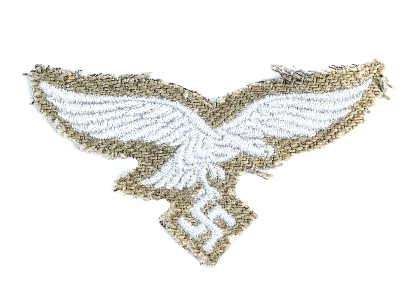 WWII GERMAN LUFTWAFFE PARATROOPER UNIFORM PATCH: A rare WWII German Luftwaffe paratrooper uniform patch. The patch is embroidered on a piece of fabric and depicts the white German Luftwaffe flying eagle with its wings straight out, holding a swastik