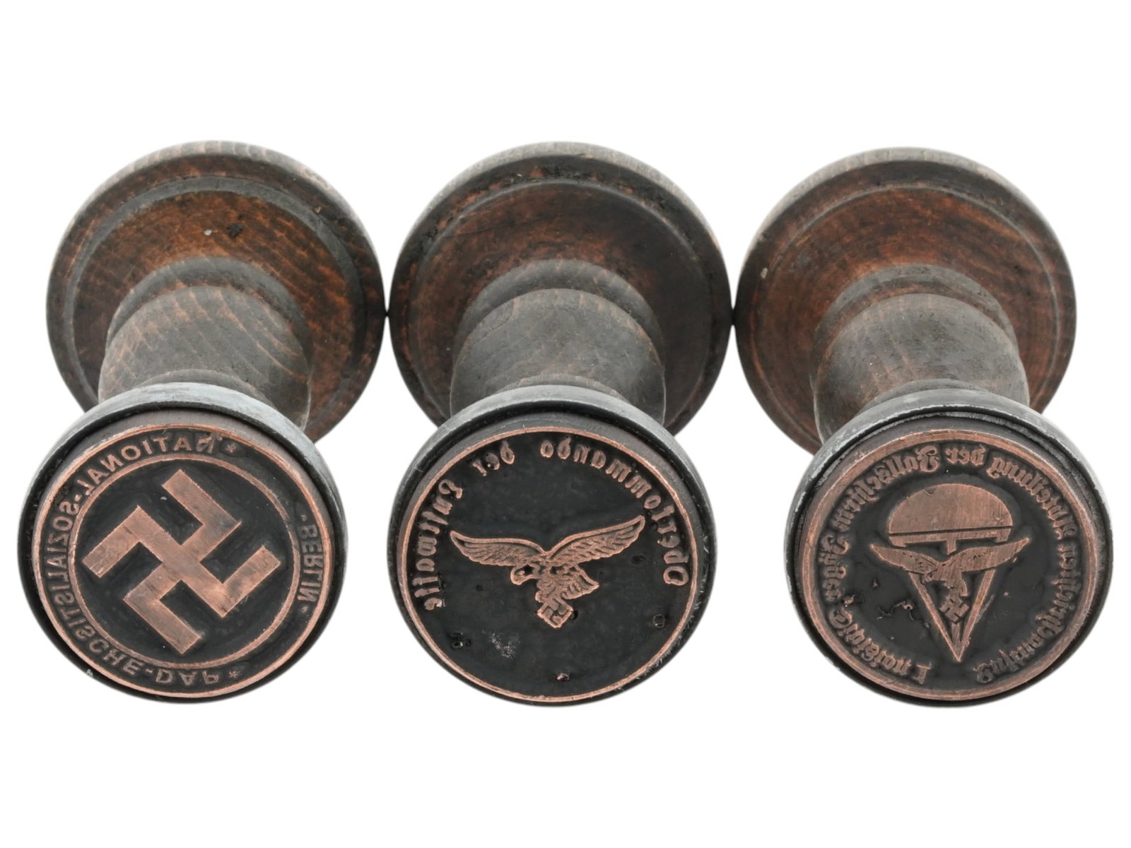 WWII TYPE GERMAN SS ADMINISTRATIVE HAND STAMPS: A lot of three World War II model wooden hand stamps of Nazi German administrations. Oberkommando der Luftwaffe, High Command of the Aviation. National-Sozialistische-DAP Berlin. Luftnachrichten Abtei