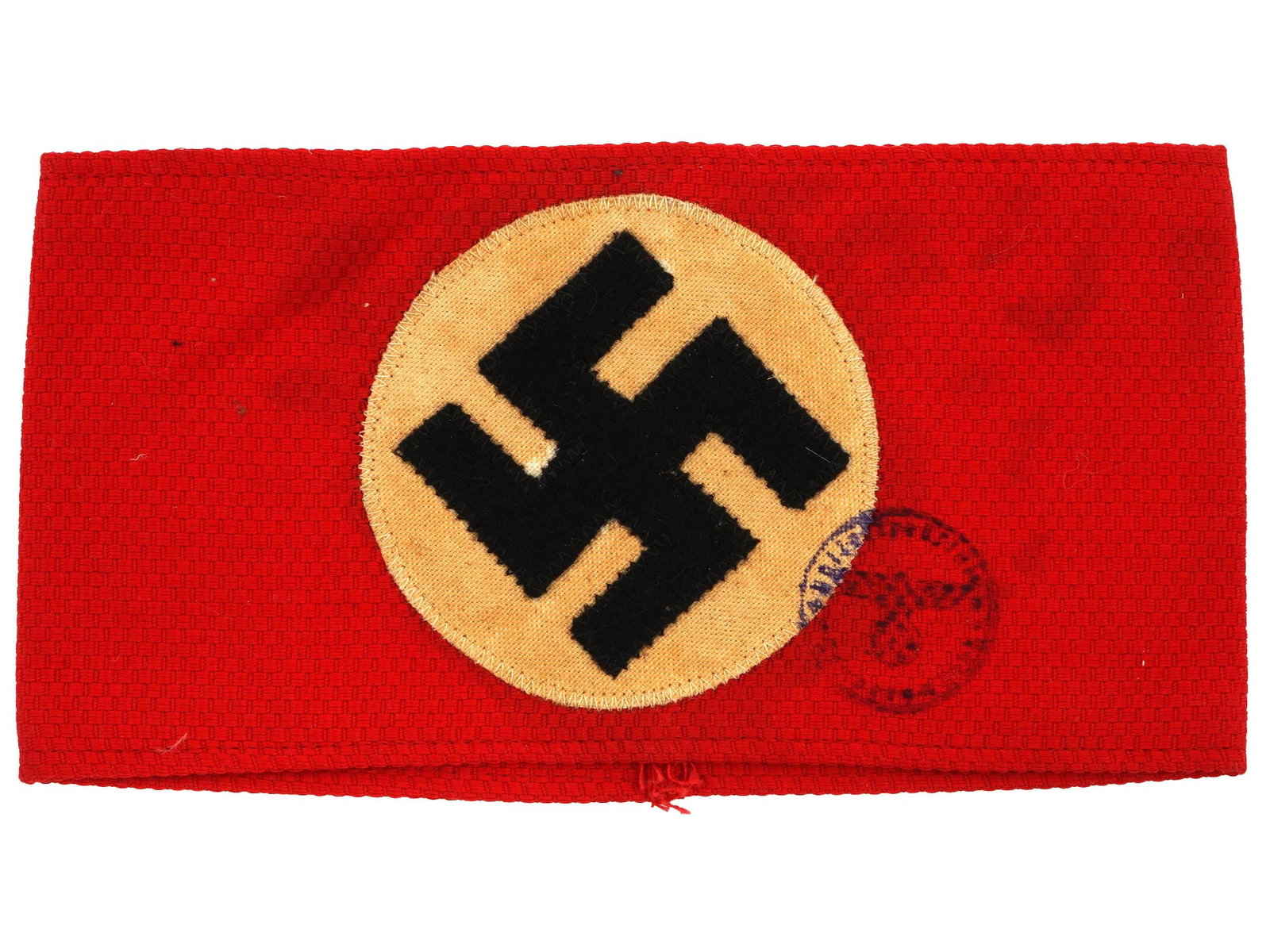 WWII NAZI GERMAN NSDAP PARTY ARMBAND W SWASTIKA: A WWII type Nazi German NSDAP National Socialist German Workers Party armband. Features a red cotton based ground with a central, circular white field and a canted swastika in the front center. The it