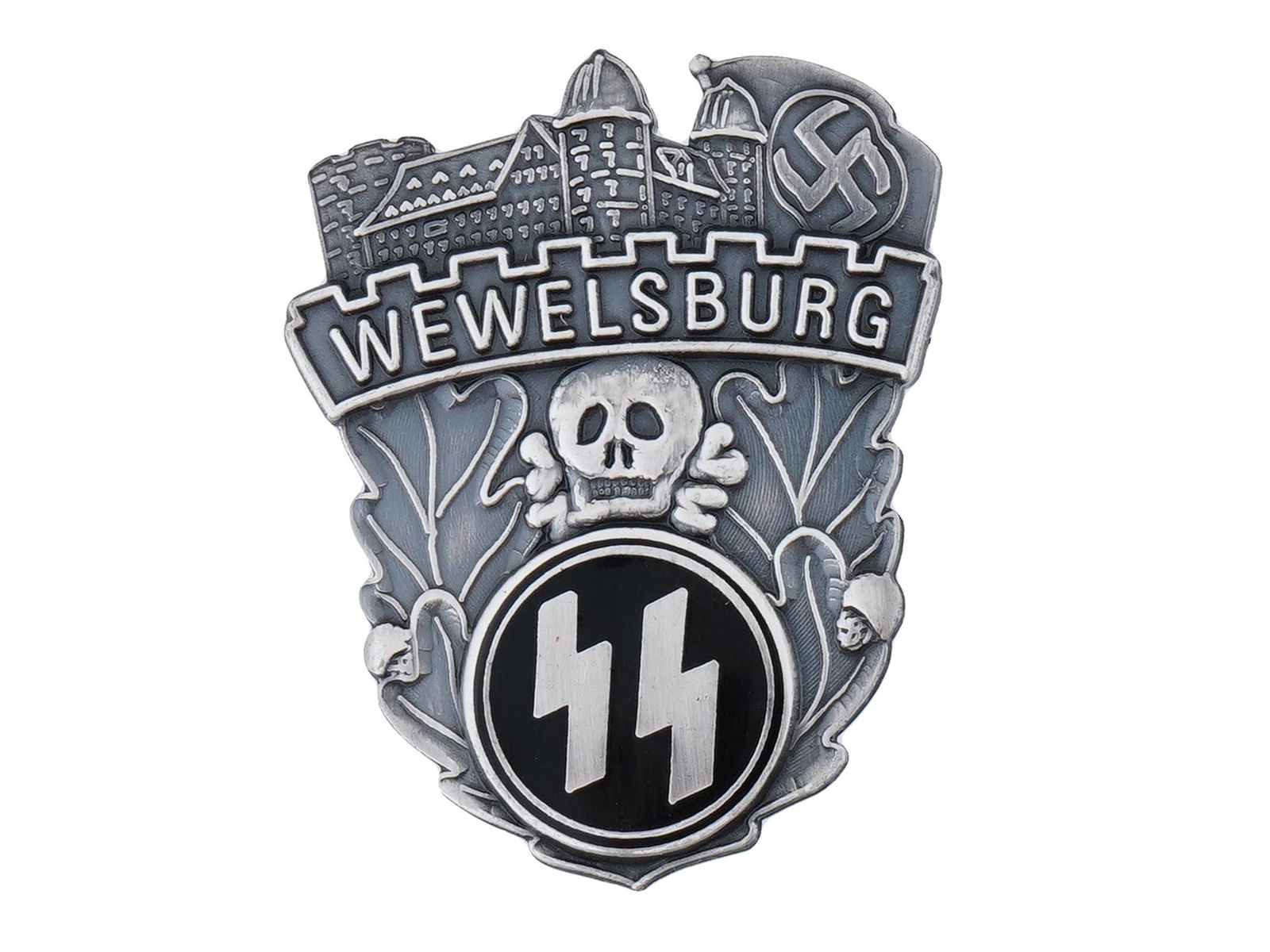 GERMAN WWII MODEL SS WEWELSBURG ACADEMY BADGE: A Second World War model Nazi German Wewelsburg SS Academy badge with engraved images of a castle and a swastika on top, inscription Wewelsburg, oak leaves, a skull with bones Totenkopf in the middle,