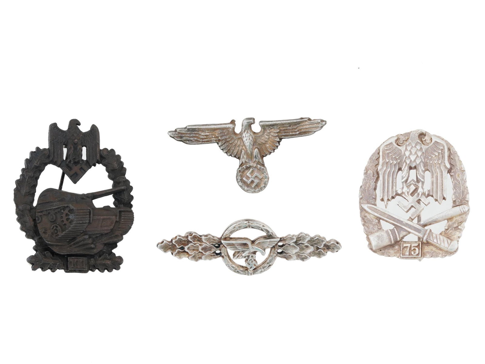 GROUP OF FOUR WWII TYPE NAZI GERMAN MILITARY BADGES: A group of four WWII type Nazi German military badges. Including an Army General Assault badge awarded for 75 assaults, an Army Tank Assault badge awarded for 100 assaults, a Luftwaffe squadron clasp 