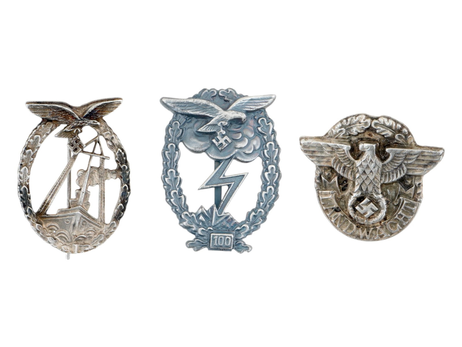 GROUP OF THREE WWII TYPE NAZI GERMAN MILITARY BADGES: A group of three WWII type Nazi German military badges. Includes a Luftwaffe Sea Battle badge, a Luftwaffe Ground Assault badge awarded for 100 assaults, and a Police Landwacht badge. Second World War
