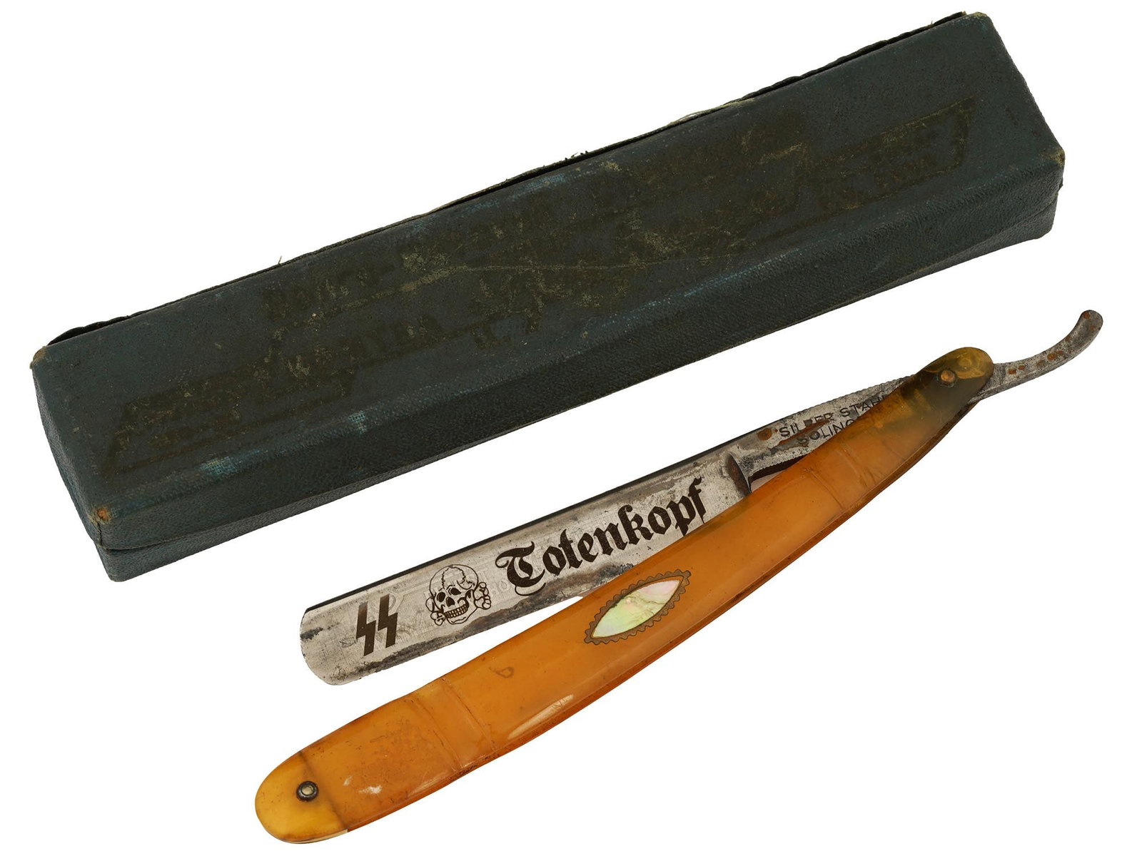 WWII NAZI GERMAN WAFFEN SS TOTENKOPF SHAVING RAZOR: A WWII Nazi German Waffen SS Panzer Division Totenkopf straight shaving razor with case. The stainless steel blade is hallmarked Solingen. The Totenkopf emblem and SS runes decorate the blade. Second 