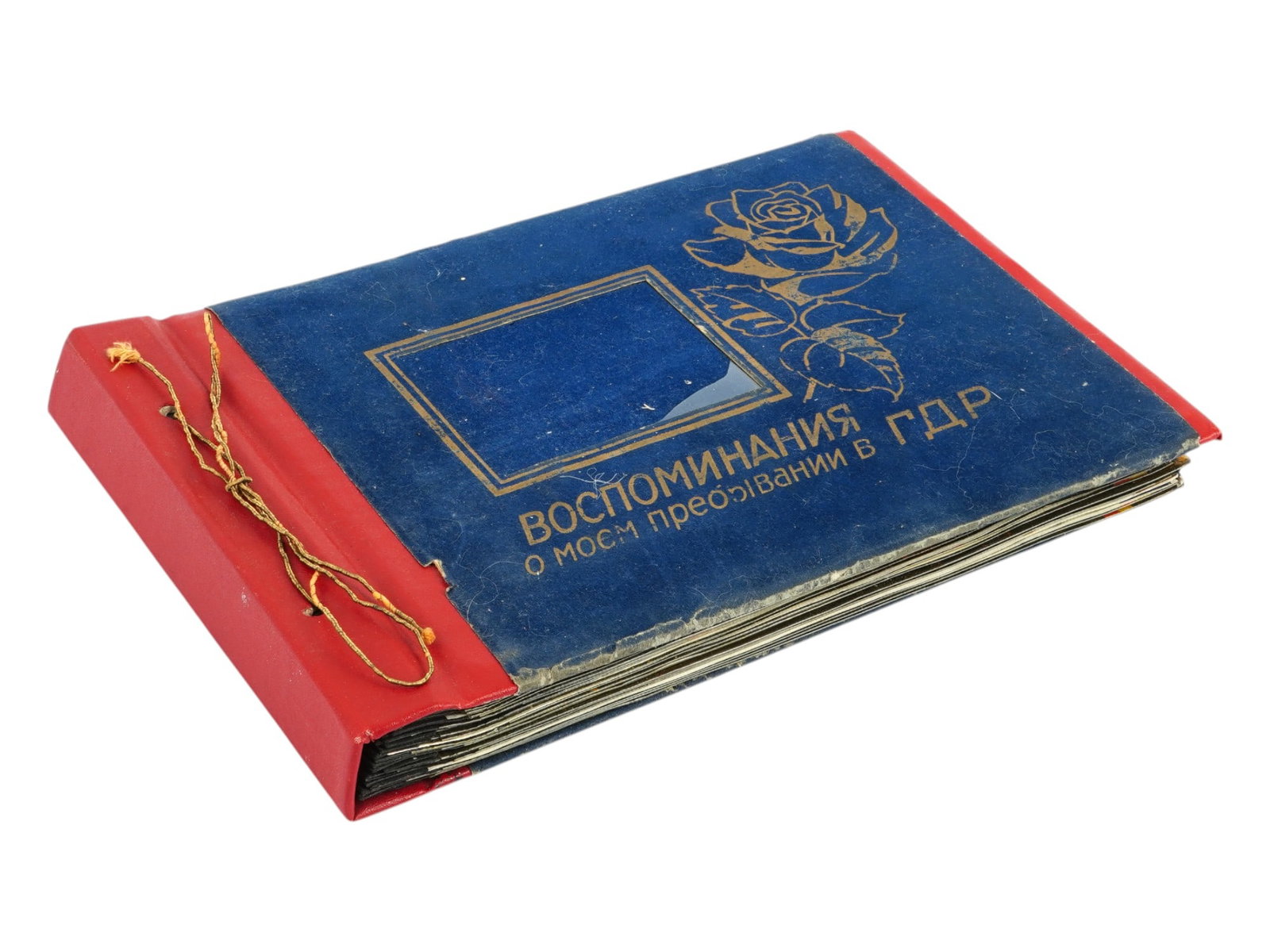 RUSSIAN SOVIET ERA MILITARY PHOTO ALBUM SERVICE IN DDR: A Russian photo album. Late Soviet era ca. 1970s to 1980s. Titled Memories About My Service in the DDR on the cover. The album features photos, drawings, newspaper cut outs and stickers. Russian Milit