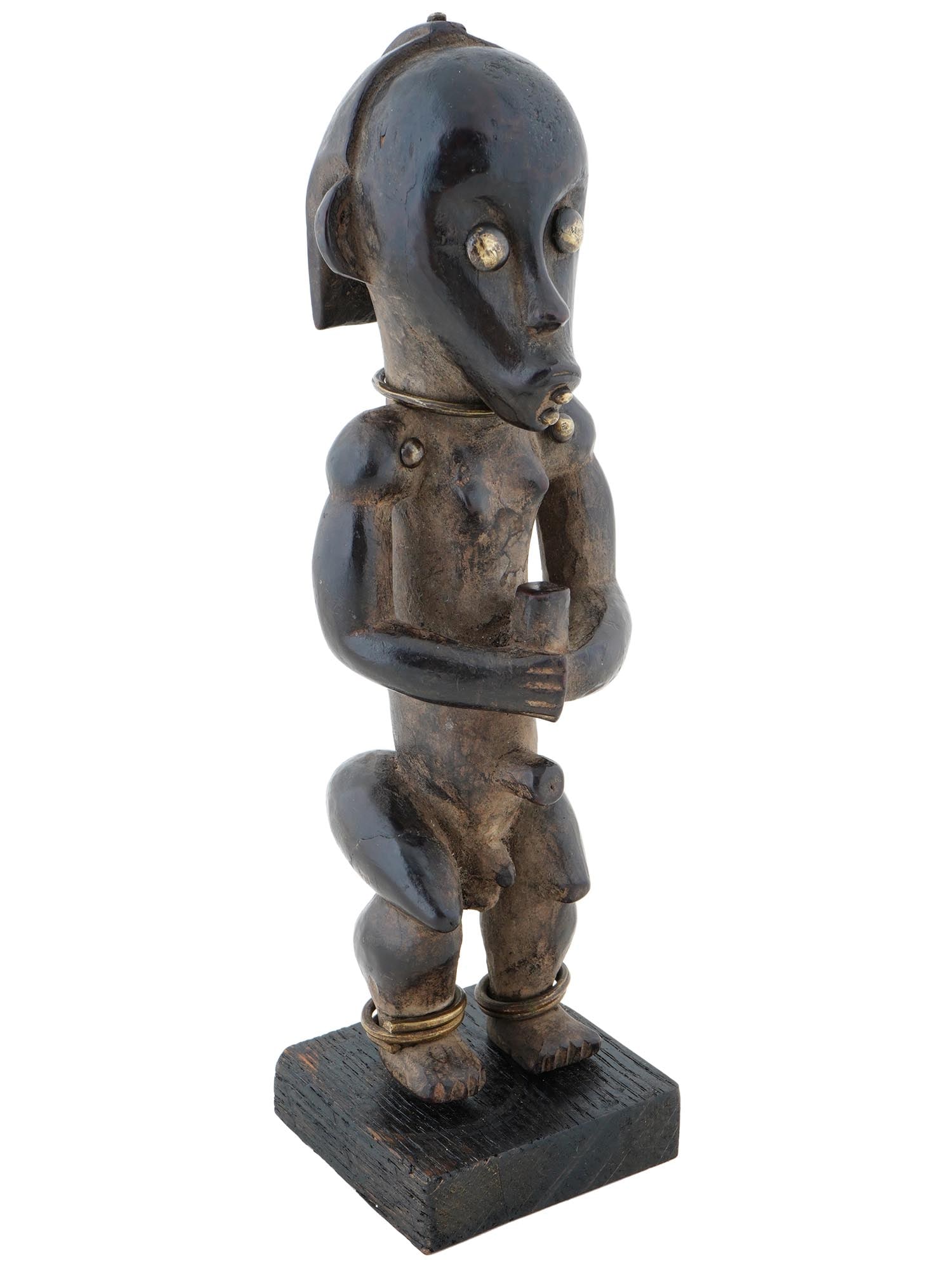 SMALL CENTRAL AFRICAN GABON WOODEN FANG BYERI FIGURE: A Central African Fang people Byeri reliquary figure from Gabon. The piece is a byeri, the representation of an ancestor used in worship ceremonies. This figurine represents a small male figure with e