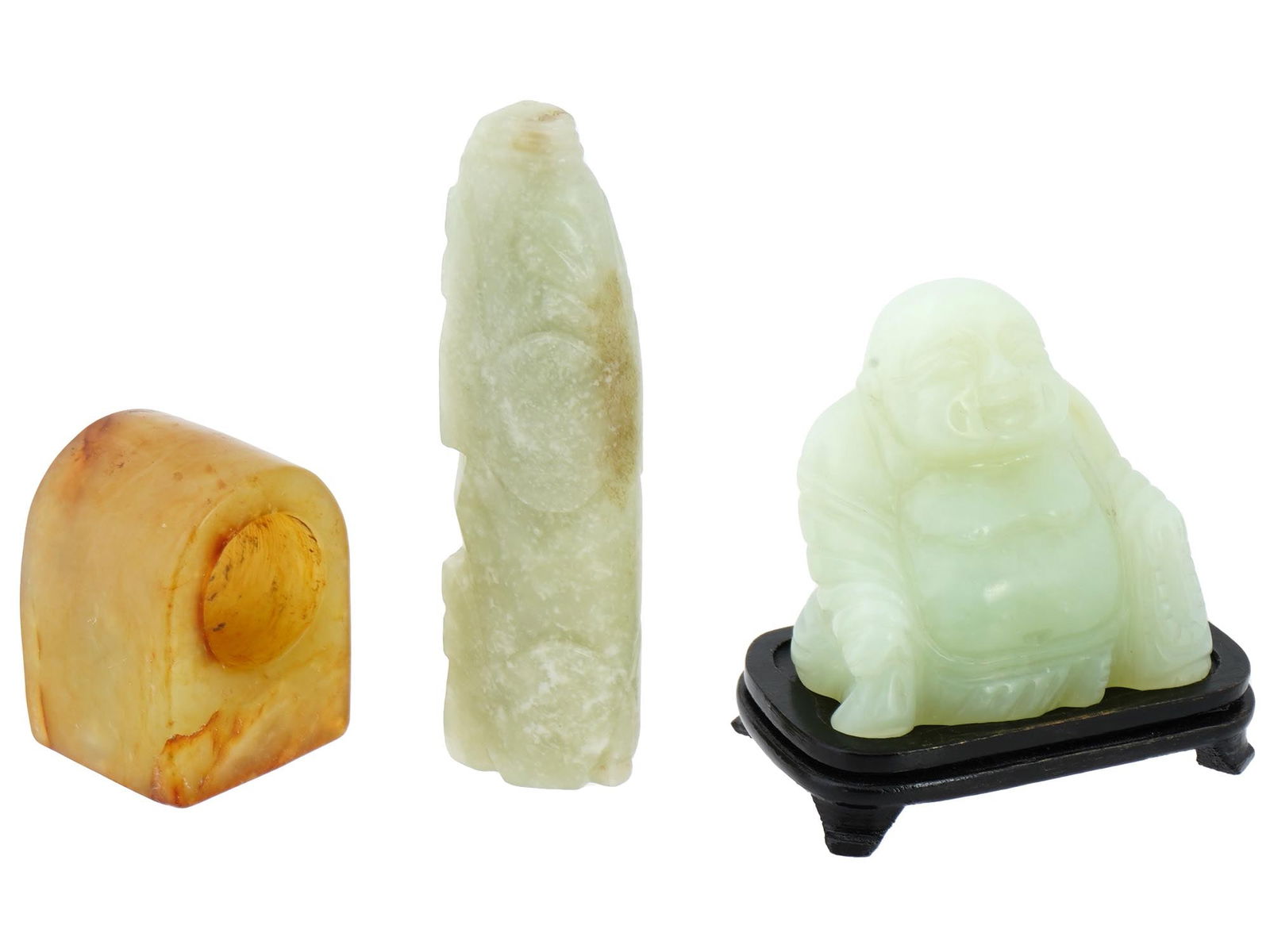 CHINESE HETIAN WHITE JADE SEAL AND FIGURINES: A lot of three Chinese hetian jade items. One item is a square shaped seal with hieroglyphs. The upper part of which is rounded and forms a ring for holding The second item is a hand carved jade figur