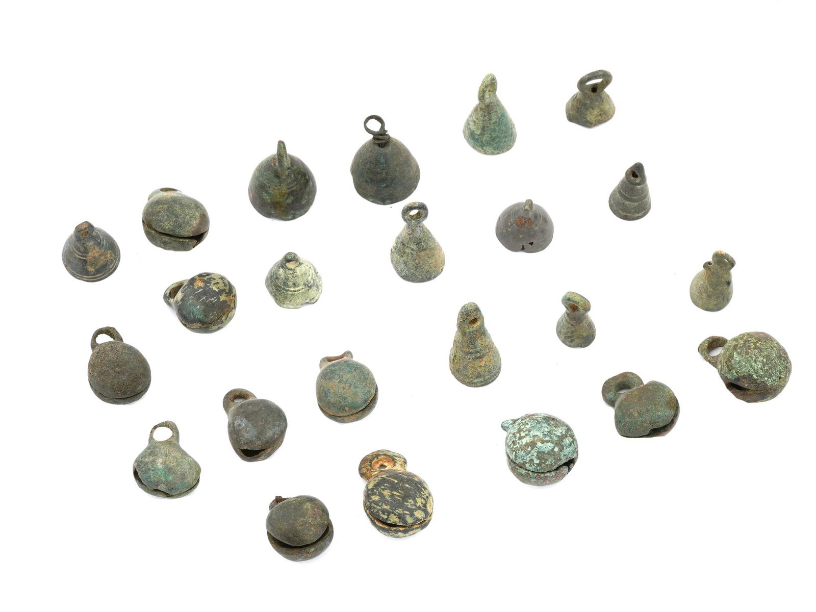 ANCIENT HOLY LAND BRONZE BELLS 500 BC TO 500 AD: A collection of ancient Holy Land bronze bells dating from 500 BC to 500 AD. The collection includes 23 bells of various shapes with engraved patterns and loops for suspension. Ancient Holy Land Artif