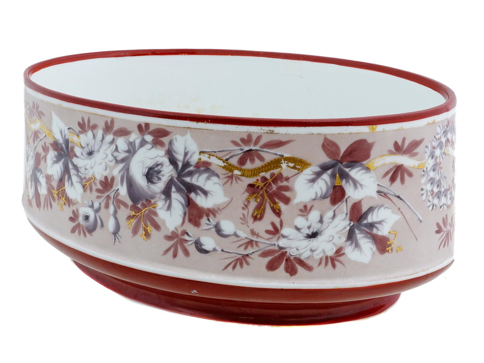 ANTIQUE FRENCH PORCELAIN JARDINIERE WITH FLORAL DECOR: An antique French oval porcelain jardiniere. The pot features hand painted floral decorations to the surface, typical of the periods aesthetic. Dating to the late 19th century. Antique Porcelain Garde