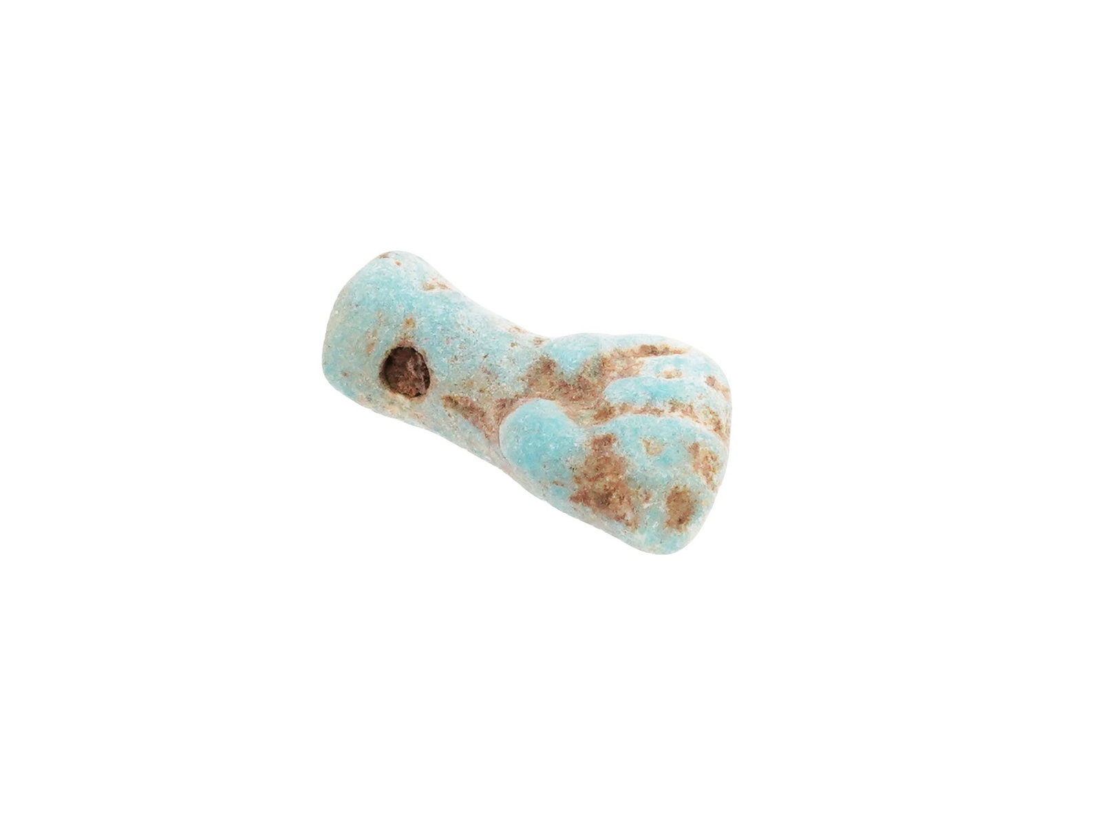 ANCIENT EGYPTIAN FAIENCE PROTECTIVE POWER FIST AMULET: An ancient Egyptian protective power amulet dating from 500 to 200 BC. Depicts a hand in a fist. This amulet, crafted from faience, symbolizes protection and strength, embodying ancient Egyptian belie