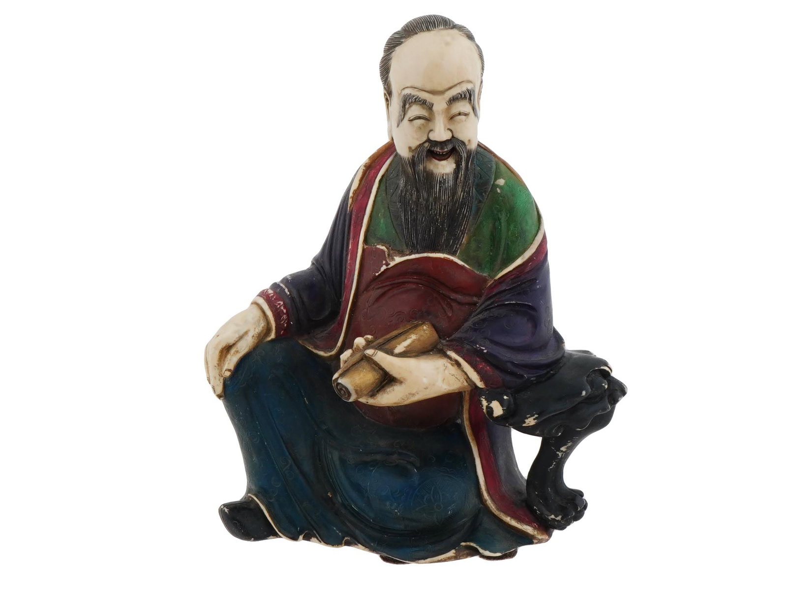 VINTAGE CHINESE SCHOLAR W SCROLL CARVED FIGURINE: A vintage Chinese Scholar carved figurine. The figurine represents a laughing, high browed Chinese sage, seated with a paper scroll in his hand. Protective fabric on the bottom. Vintage and Modern Asi