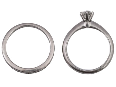 LOT OF TWO TIFFANY AND CO PLATINUM RINGS WITH DIAMONDS