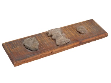 ANCIENT PRE COLOMBIAN TERRACOTTA FACES ON WOODEN PLAQUE