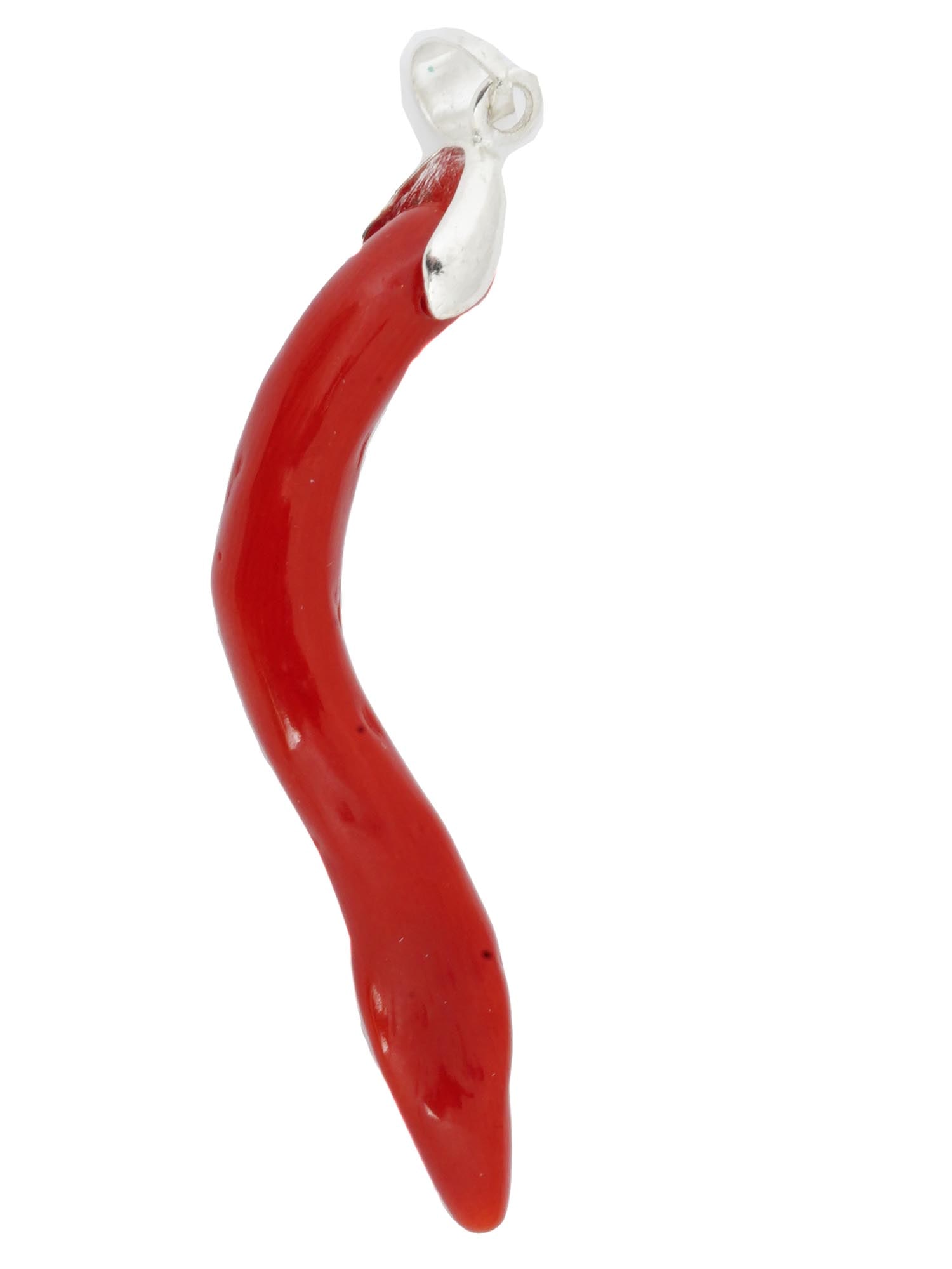 VINTAGE ITALIAN RED CORAL SILVER CORNICELLO CHARM: A vintage genuine red coral pendant representing a cornicello, also known as the Italian horn, an amulet shaped as a twisted horn. Silver fittings, unmarked. Provenance: Mediterranean coral house, Tab