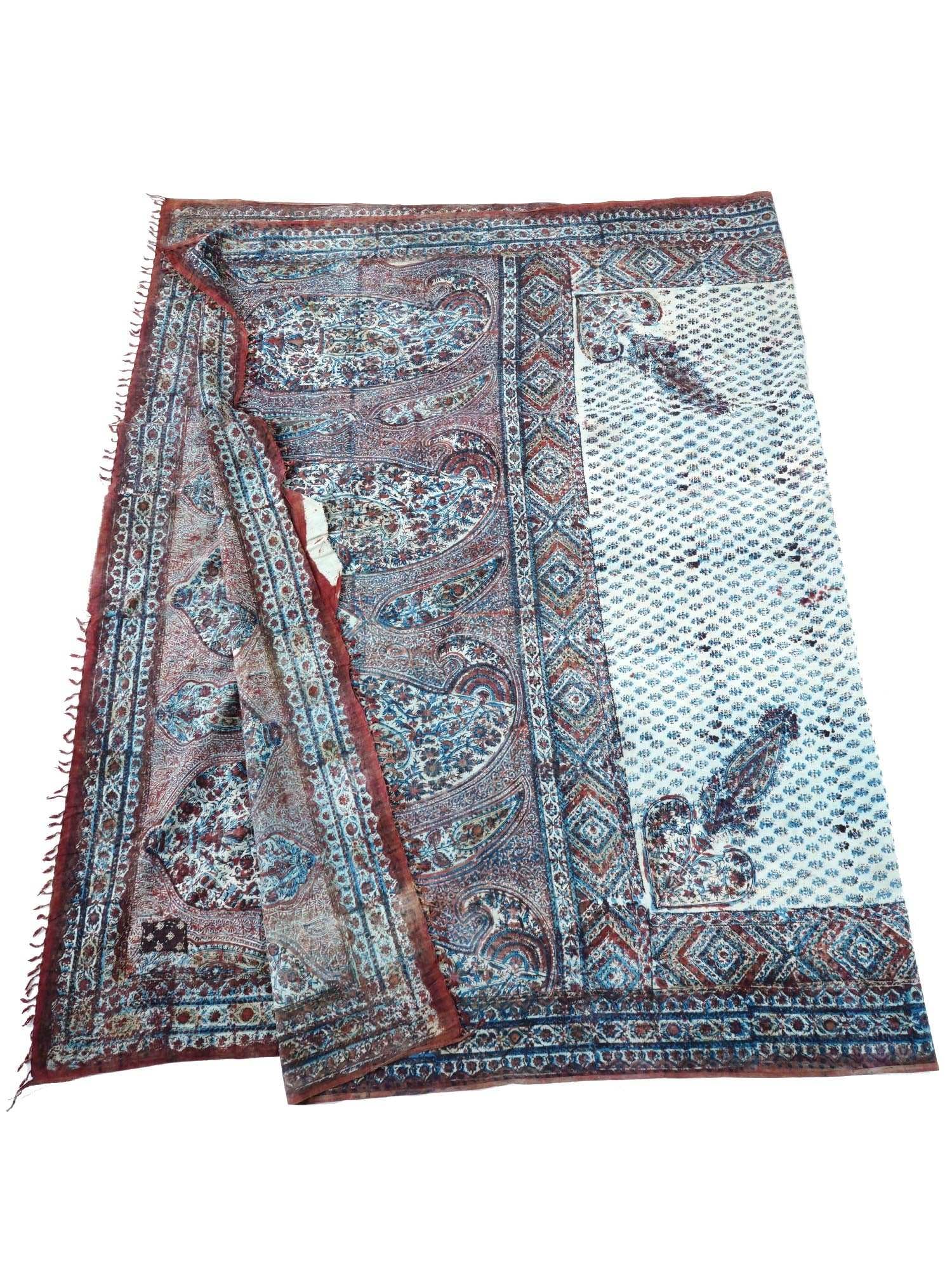 CLASSIC ANTIQUE PERSIAN KALAMKARI COTTON TEXTILE: An antique Persian Kalamkari cotton textile. The textile is adorned with traditional polychrome floral, foliage, geometrical and paisley patterns. The ware is decorated with fringes on the sides. Circ